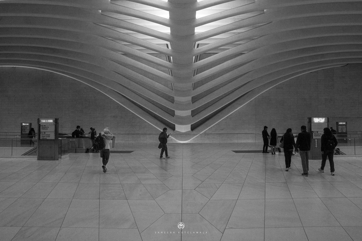 TenishaLongacre's tweet photo. Symmetry in Motion”—a quiet moment inside the World Trade Center Station, where architectural lines, light, and the flow of commuters converge. Shot on Sony. https://t.co/mKiar1KX1s