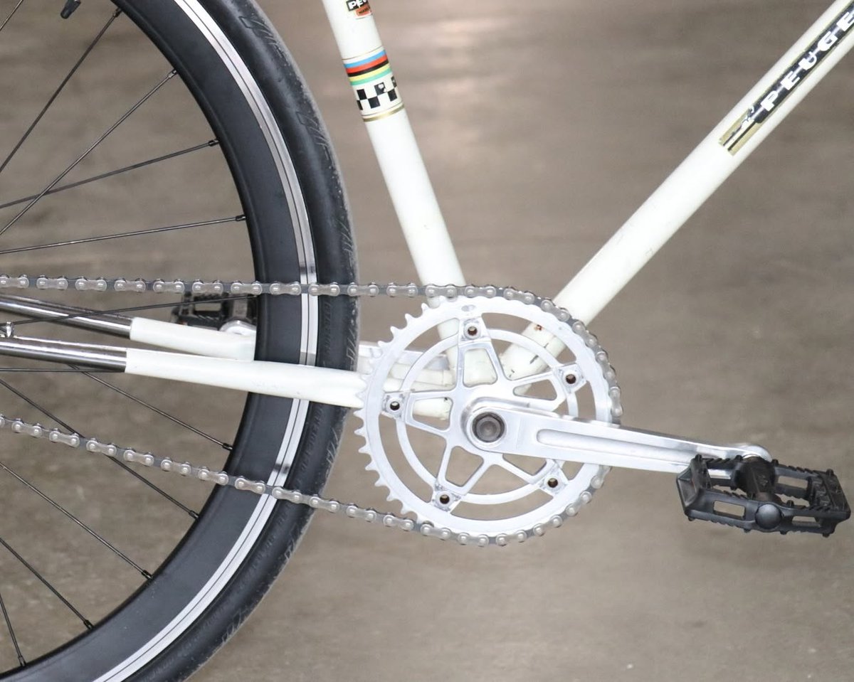 JodieVanoni's tweet photo. Custom-built single-speed coffee shop cruiser based on a 1967 Peugeot UO8 frame, retaining original Mafac Racer brakes, Stronglight cranks, and headset. A fun city bike for relaxed cruising. https://t.co/rFi9DpiXG2