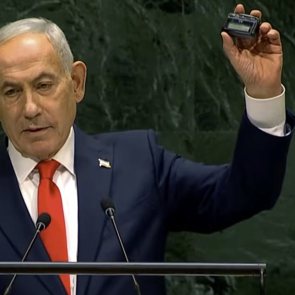 PhilipProudfoot's tweet photo. The liberal "rules-based order" –– a war criminal, boasting at the UN about a mass-IED attack, boobytrapping a global supply chain, killing and maiming Lebanese children, and violating multiple articles of international law https://t.co/2a64gzHQgt