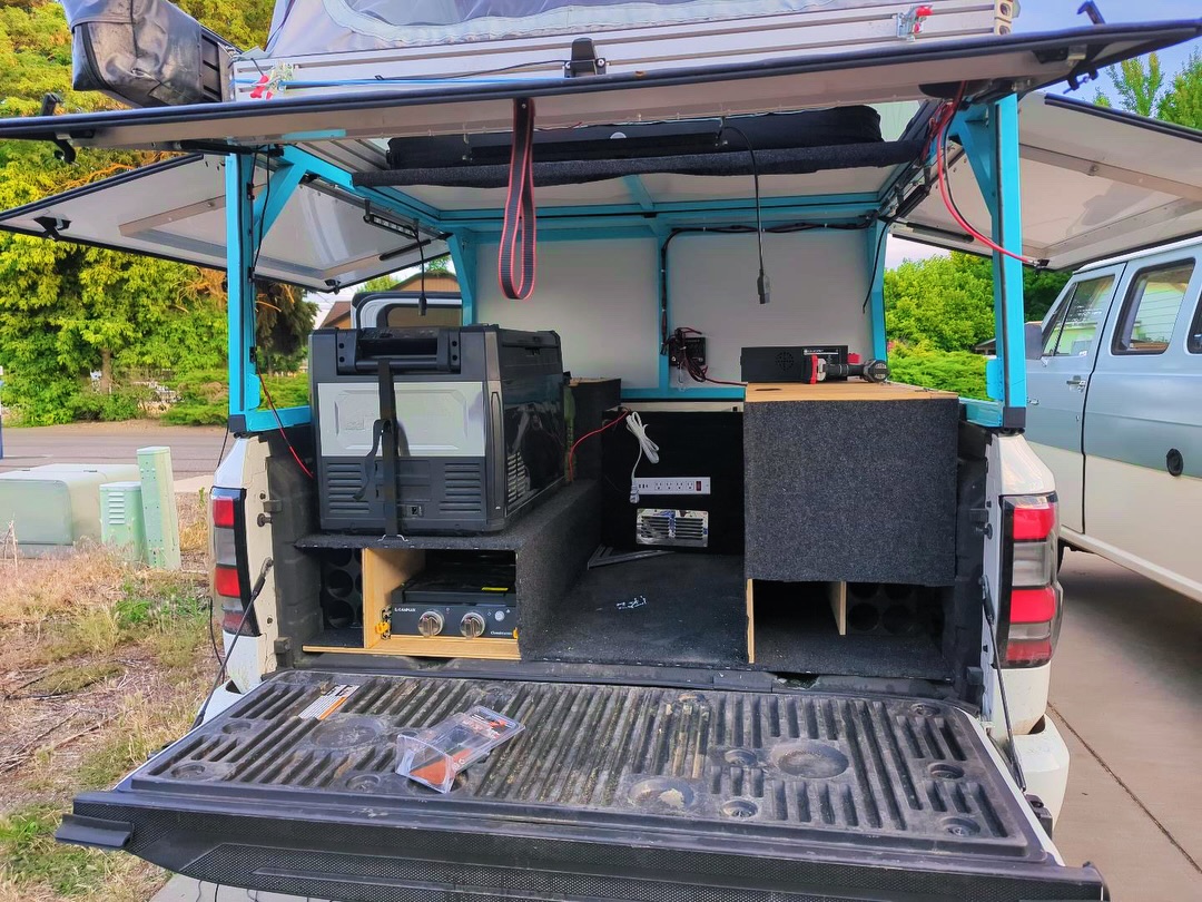MauricioBao8's tweet photo. Let's keep the day going with @shrednecks’ 2022 Nissan Frontier and garage-built camper. They traveled from Washington through Canada to Tuktoyaktuk and Alaska for salmon fishing, herping, and tidepooling. Love the salmon-themed wrap! https://t.co/wrn80tMDqD