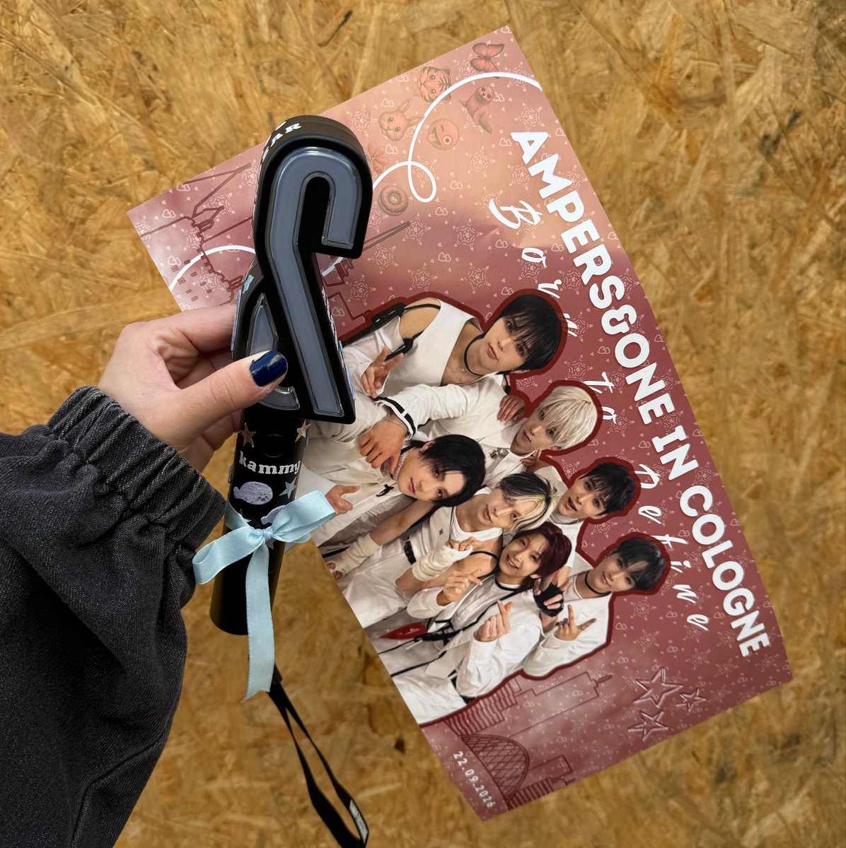 luckykammy's tweet photo. does anyone have videos of the members holding the signs me and my friends designed for the cologne show? i would lovee to have some more video proof that they held them and looked at them 🤭 https://t.co/DFhpnLHuZb
