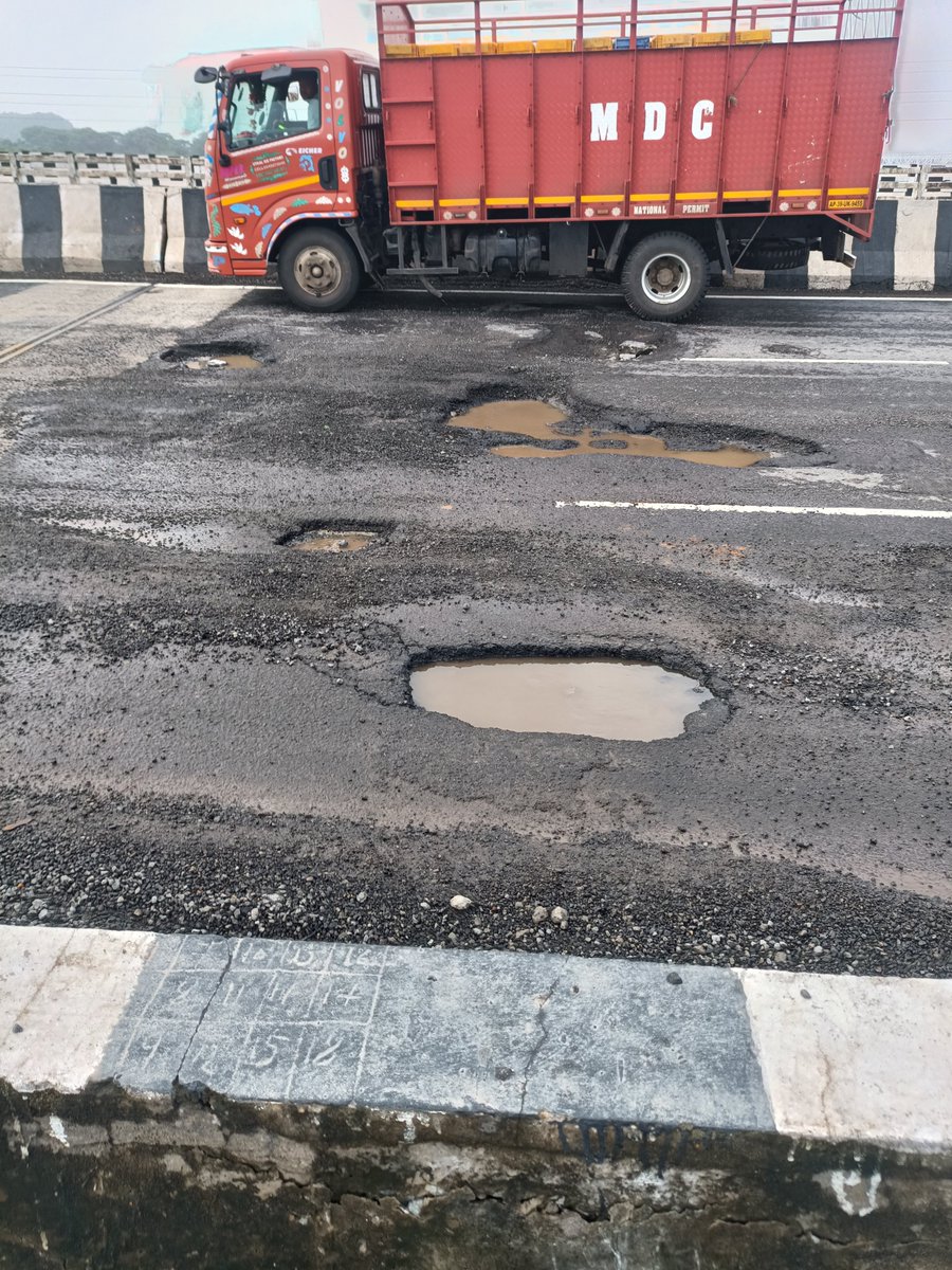 Prasad0x's tweet photo. 🚨 URGENT: NH-16 at Rushikulya Bridge , Ganjam is in terrible condition. Large potholes are forcing vehicles to slow down and weave around them. At night this is a serious accident risk. Please repair this stretch immediately. @NHAI_Official @nhai_ro @nitin_gadkari @MohanMOdisha https://t.co/fEaHib5zxX