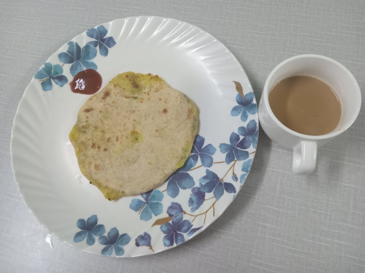 ArunaM40's tweet photo. It's  been raining for three days and will continue. No where to to go. Just having Aaalo paratha and a cup of tea. https://t.co/IYB3Pckuiz