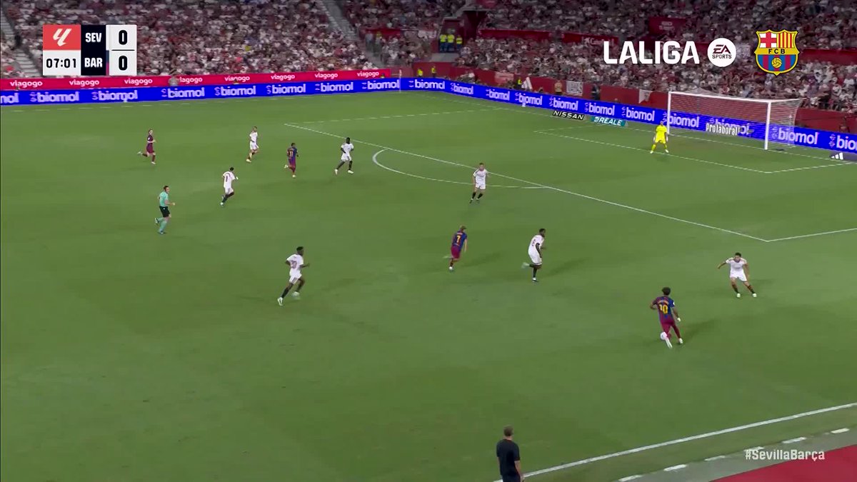 A screenshot from a La Liga match shows Sevilla vs. Barcelona tied at 0-0 with 07:01 on the clock, as Barcelona (in blue and red) advances the ball near Sevilla's goal. The post's caption suggests Lamine Yamal nearly scored another spectacular goal during this sequence.