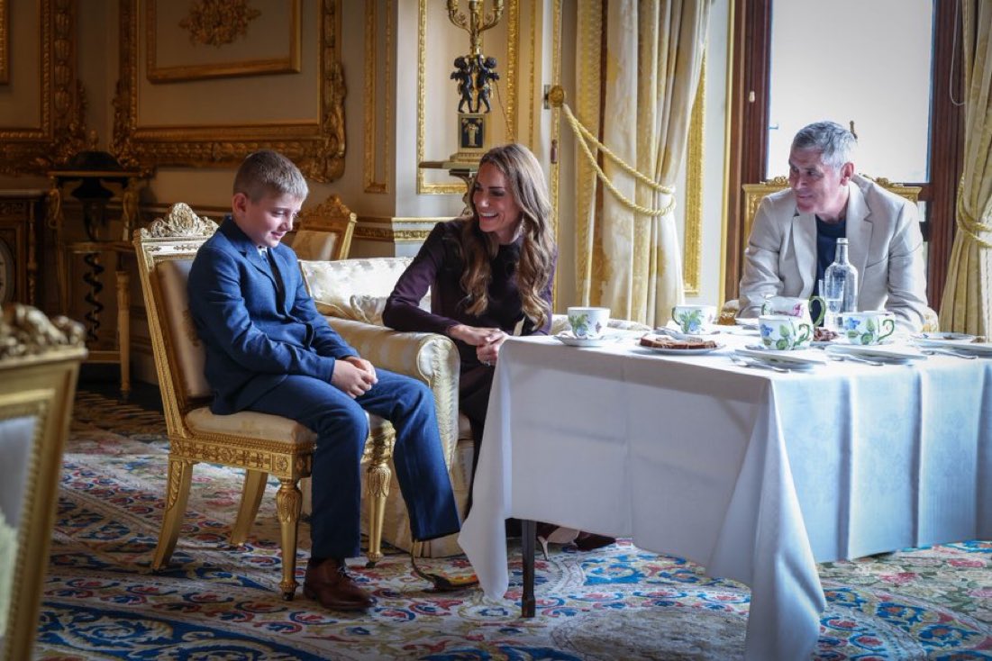 QLoTII's tweet photo. She finished her climb at the foot of Yr Wyddfa with William and the children waiting. And then, months later, quietly, she invited those people to Windsor Castle for tea and cake. No press. No speech. A few chairs in a state room and a princess pouring for a boy who'd been carried up a mountain by the people who love him.

Her message with it was one line: recovery is rarely a journey we make alone.

That's the thing about her. It was never about her climb. She said at the time it was a small way to give something back, and she meant it, but the truer measure is what she did with the people she met on the way up. She noticed them. She remembered their names. She had them to her house.