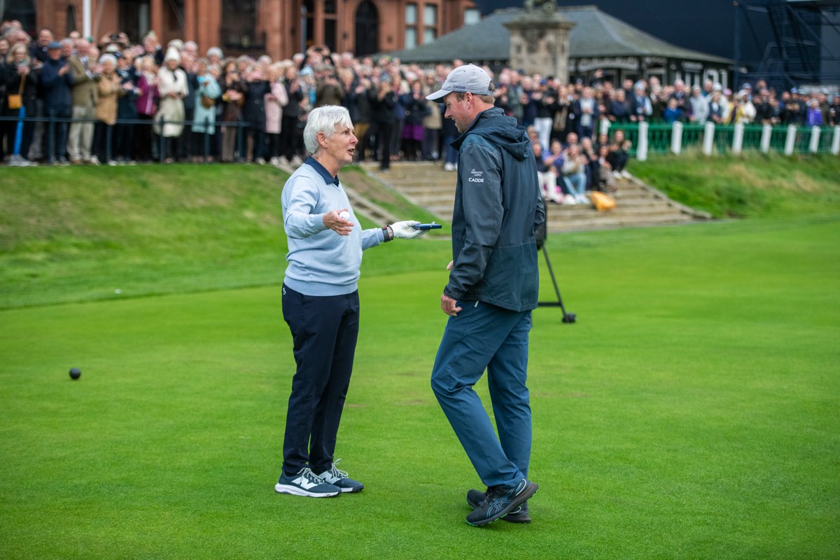 RandA's tweet photo. Claire Dowling becomes the first woman to serve as Captain of The Royal and Ancient Golf Club of St Andrews 💙

In front of a packed crowd at the Old Course, Claire launched her opening drive down the fairway to officially commence her term with caddie, Dillon McCarron successfully returning her ball.