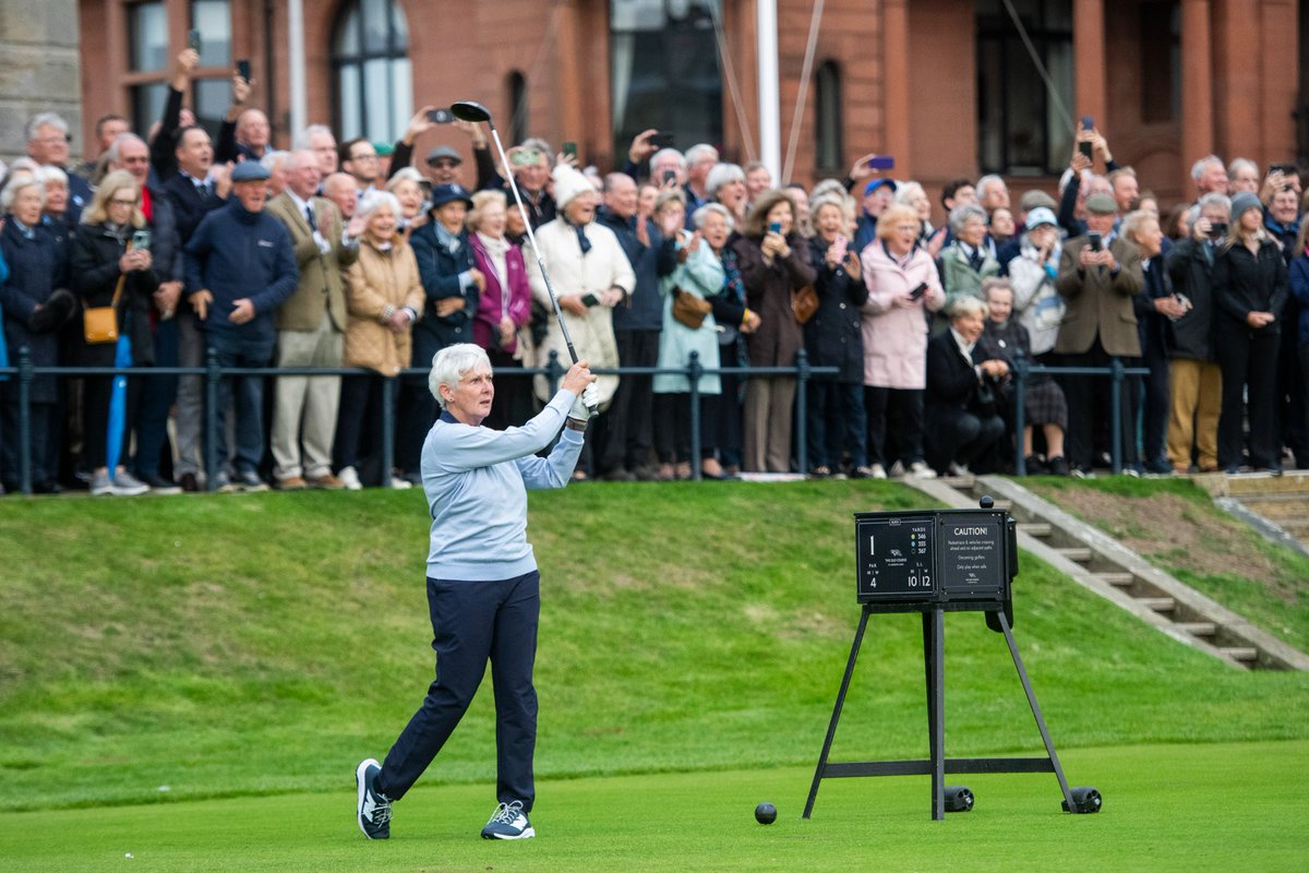 RandA's tweet photo. Claire Dowling becomes the first woman to serve as Captain of The Royal and Ancient Golf Club of St Andrews 💙

In front of a packed crowd at the Old Course, Claire launched her opening drive down the fairway to officially commence her term with caddie, Dillon McCarron successfully returning her ball.
