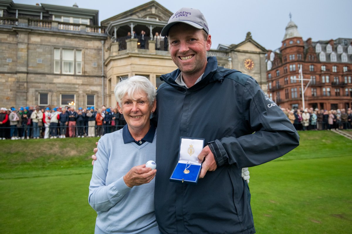 RandA's tweet photo. Claire Dowling becomes the first woman to serve as Captain of The Royal and Ancient Golf Club of St Andrews 💙

In front of a packed crowd at the Old Course, Claire launched her opening drive down the fairway to officially commence her term with caddie, Dillon McCarron successfully returning her ball.