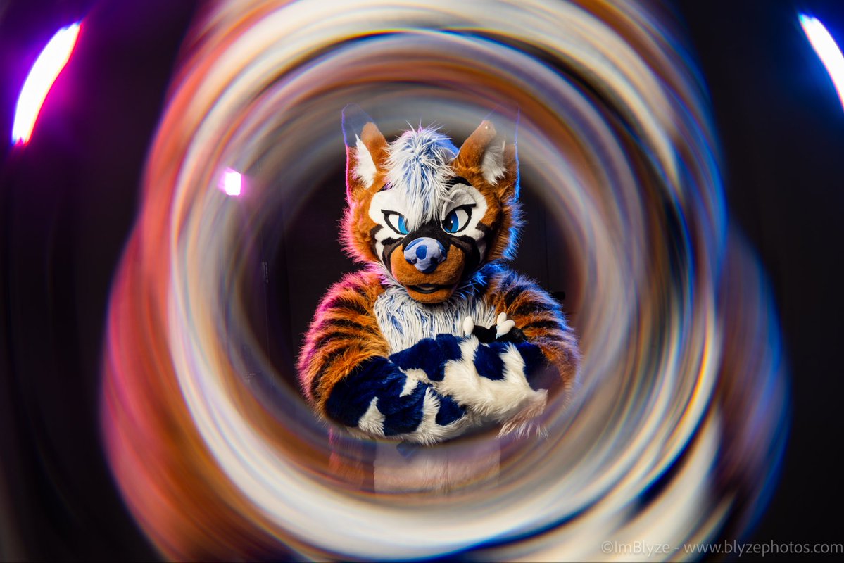 ImBlyze's tweet photo. Swirly #FursuitFriday photo.  Had to jump in front of the camera to test this lighting and effect combo. I love it! 

Suit @ThatsFurredUp https://t.co/lEGZ3qVMIv