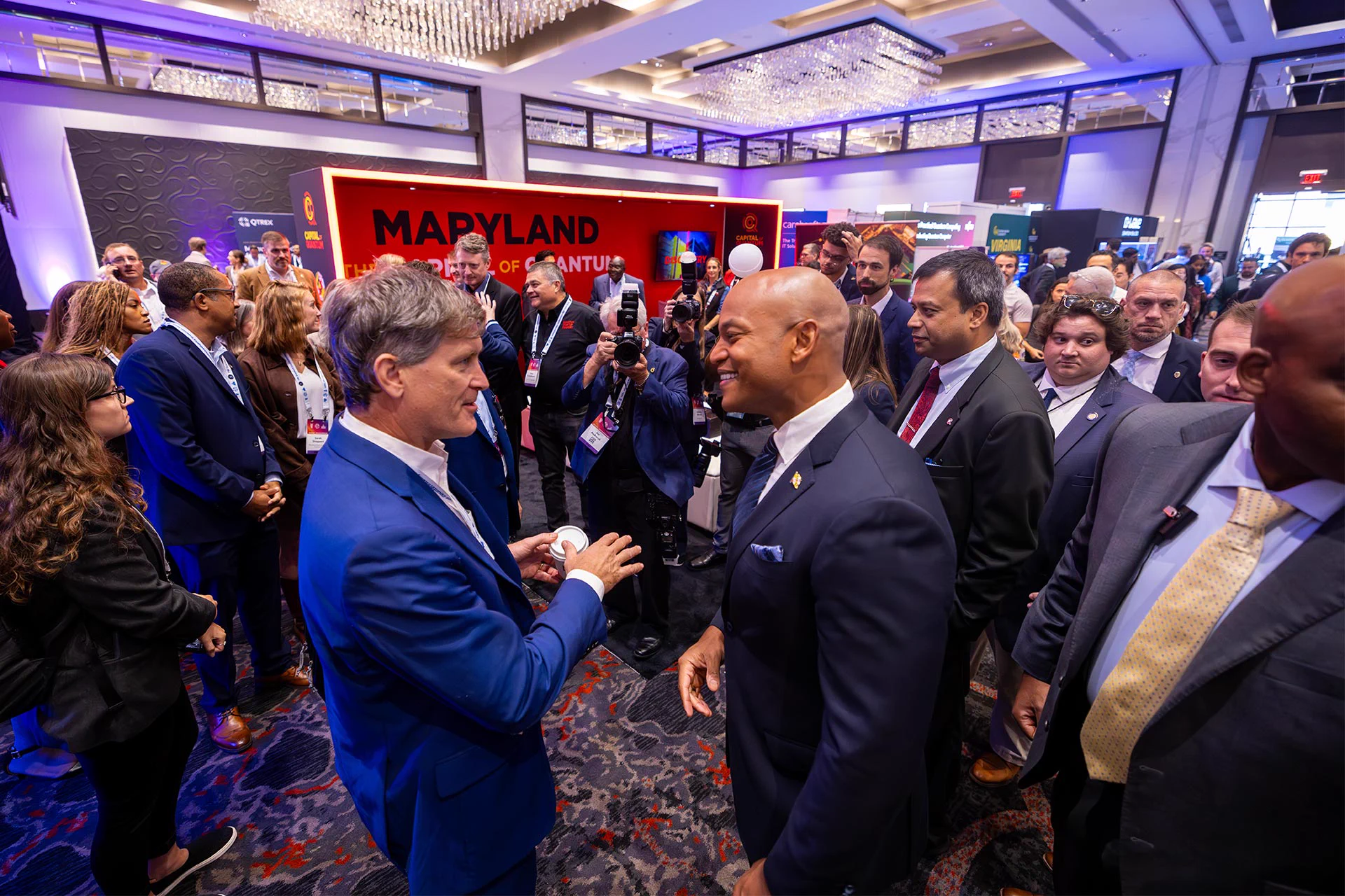 Alex Cronin, a quantum science program director for the National Science Foundation, speaks with Gov. Wes Moore at the Quantum World Congress. 