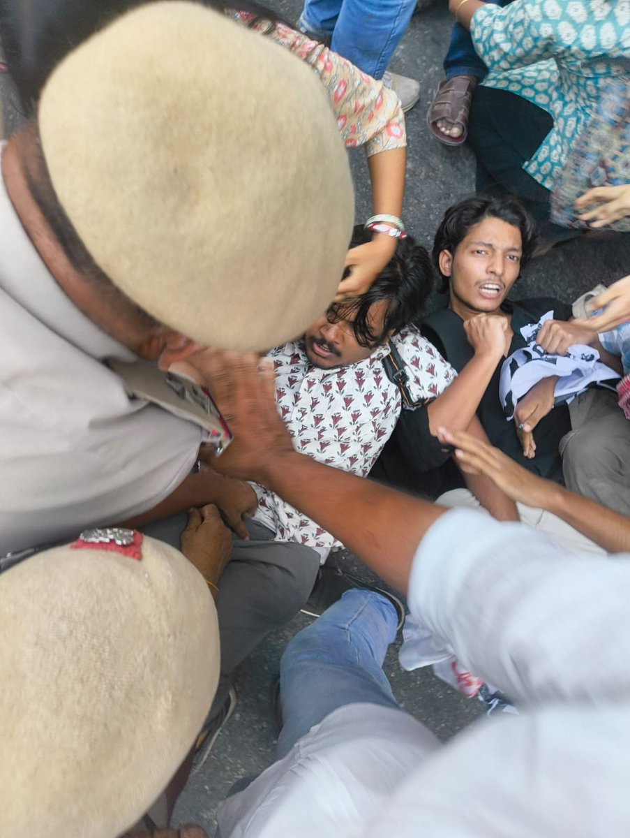 SFI_CEC's tweet photo. Police Brutality Against Peaceful SFI-DYFI Protest to the Election Commission of India; Arrest of MPs and Student-Youth Leaders Condemned

The brutal police crackdown on the peaceful SFI-DYFI protest demanding the resignation of Chief Election Commissioner Gyanesh Kumar is a shameful assault on democratic rights and the people's right to demand free and transparent elections in the country.

The police unleashed brutal force against peaceful protesters and arrested Comrade A. A. Rahim, Rajya Sabha MP and All India President of DYFI; Comrade Sivadasan, Rajya Sabha MP; Comrade Adarsh M. Saji, SFI All India President; and SFI Delhi leadership comrades Sooraj Elamon (Secretary), Mehina Fathima (Joint Secretary), Simran (Vice President), Anil Sethumadhavan (Vice President), Sagar Singal (Vice President), Sakhi (Secretariat member), and several other activists.

This is not merely an attack on SFI and DYFI; it is an attack on the democratic foundations of the Republic. When citizens demand an impartial Election Commission and transparent elections, the government's response cannot be lathis, physical violence and arrests. The Election Commission must remain accountable to the Constitution and the people, not function as an instrument of the ruling dispensation.

The grave mismanagement under Gyanesh Kumar's tenure, with the political backing of the Sangh Parivar-led government, demands a thorough and impartial investigation. Those responsible must be held accountable, and the credibility of the country's electoral process must be restored.

We make it unequivocally clear: we shall not move an inch backwards until Gyanesh Kumar steps down and faces trial for his grave mismanagement. No amount of police repression, intimidation or illegal detention will silence the collective voice of students and youth!

SFI CEC ✊