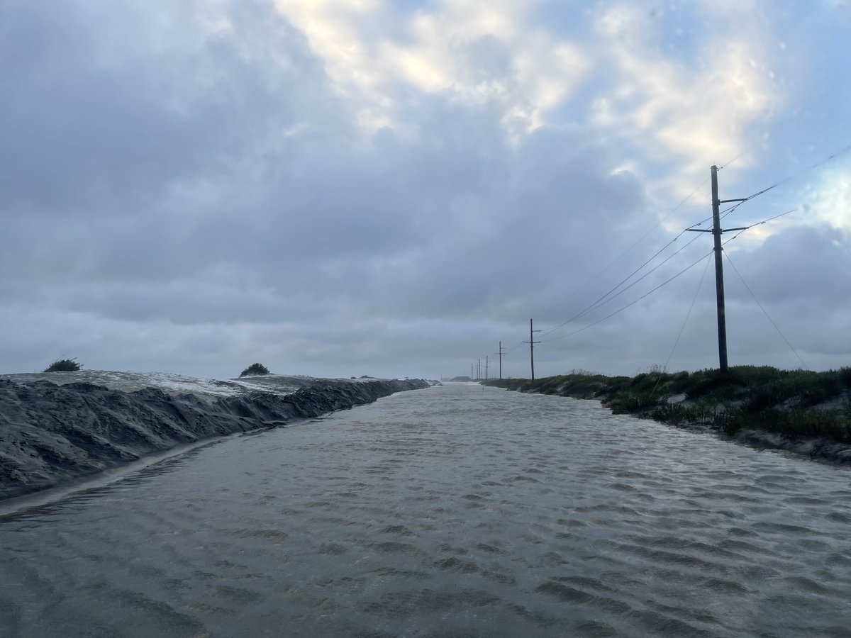 NCDOT_NC12's tweet photo. Pics from Pea Island this morning. The road is currently covered in 4' of water in some areas, as well as deep sand. At this point, it is impossible to assess the extent of any road damage, but once we do, we will have a better idea of repair/reopening options. https://t.co/6lx5zQBSzk