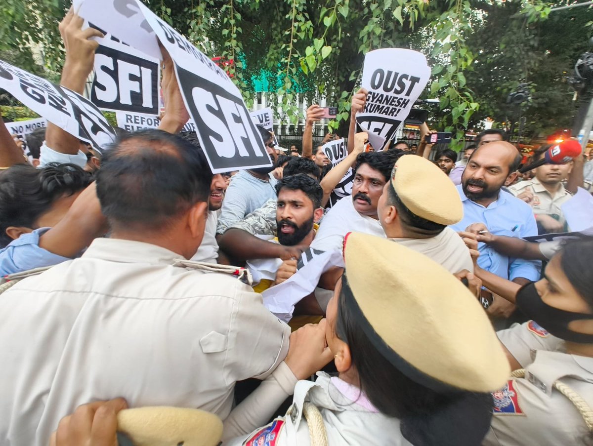 cpimspeak's tweet photo. Delhi Police cracked down on a peaceful SFI-DYFI protest march to the Election Commission of India office in New Delhi, demanding the resignation of Chief Election Commissioner Gyanesh Kumar, revocation of the Special Intensive Revision (SIR), and reforms to the Election Commission.

DYFI All India President and Rajya Sabha MP A A Rahim, Rajya Sabha MP V Sivadasan, SFI All India President Adarsh M Saji, and several SFI Delhi leaders and activists were detained during the protest. The police brutally manhandled student and youth activists, including women. SFI and DYFI condemned the police action and demanded the immediate and unconditional release of all leaders and activists, strict action against the police personnel responsible for the assault, and an end to the suppression of democratic dissent.