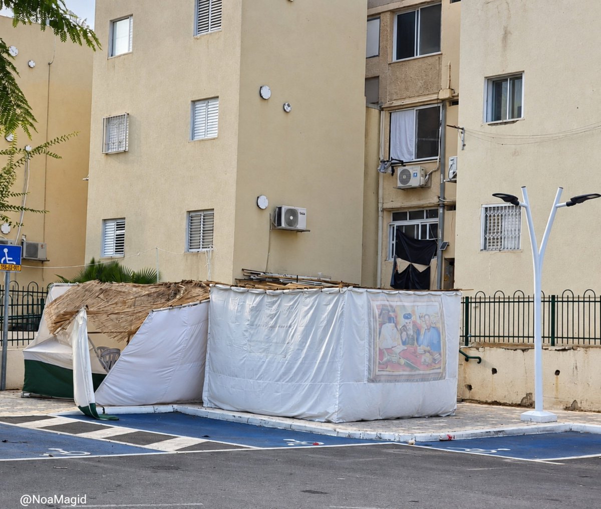 NoaMagid's tweet photo. Three years ago, so many of my people built a sukkah and never lived to take it down after the holiday.

When I arrived at the massacre sites, amid the destruction, I found so many sukkahs still standing.

They were a silent testimony to the lives that had filled those places just hours earlier - lives that were suddenly cut short.

It is a sight I will never forget.
