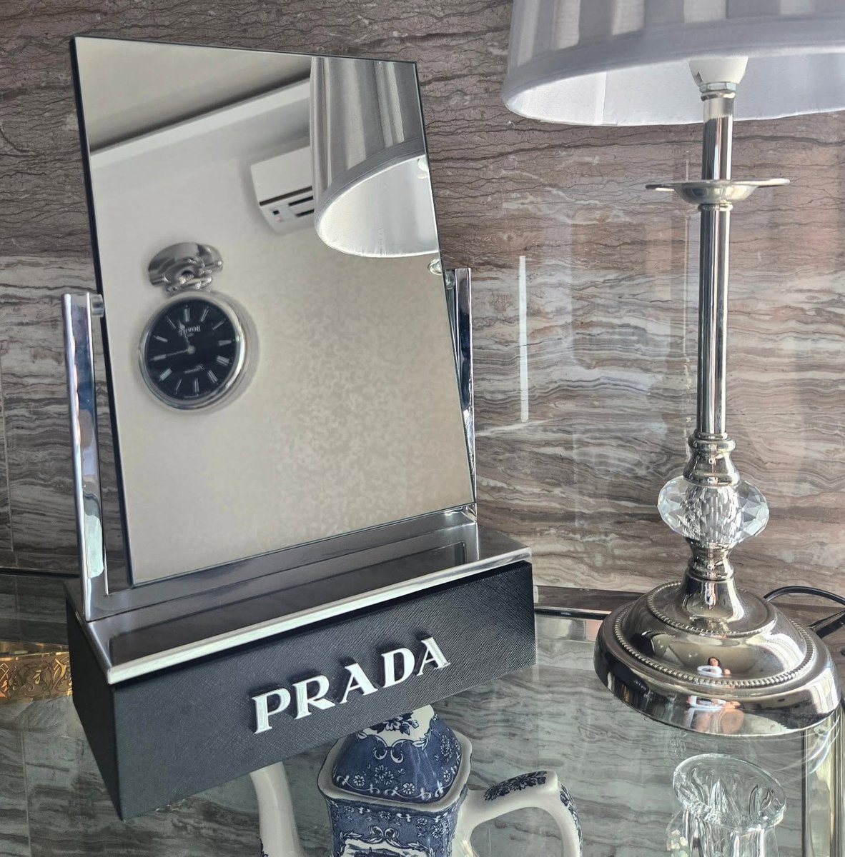 vint_agetherapy's tweet photo. Even the lamp couldn't stop looking 🪞

An original Prada vanity mirror with a black textured base and the name in raised silver letters. Our lamp spent the whole photoshoot checking itself out in it.
#vintage #prada #beauty https://t.co/8D7kBK1Ss5