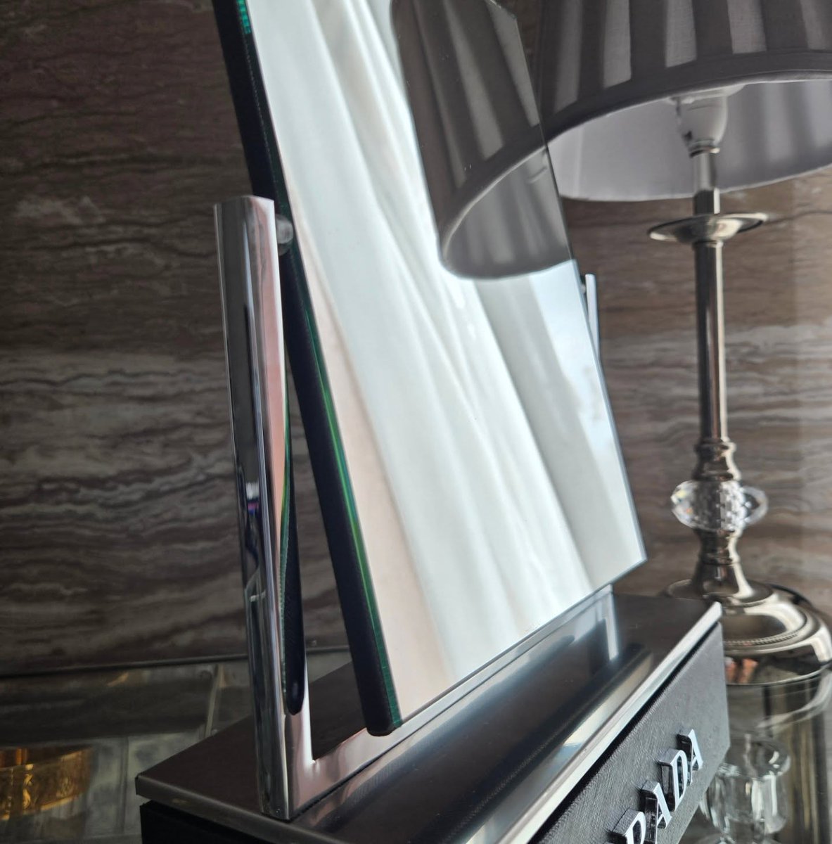 vint_agetherapy's tweet photo. Even the lamp couldn't stop looking 🪞

An original Prada vanity mirror with a black textured base and the name in raised silver letters. Our lamp spent the whole photoshoot checking itself out in it.
#vintage #prada #beauty https://t.co/8D7kBK1Ss5