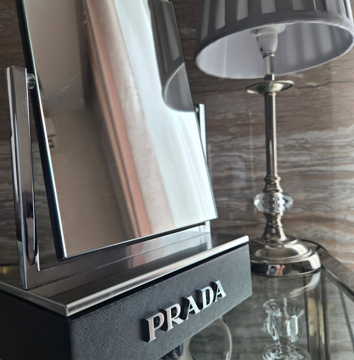 vint_agetherapy's tweet photo. Even the lamp couldn't stop looking 🪞

An original Prada vanity mirror with a black textured base and the name in raised silver letters. Our lamp spent the whole photoshoot checking itself out in it.
#vintage #prada #beauty https://t.co/8D7kBK1Ss5