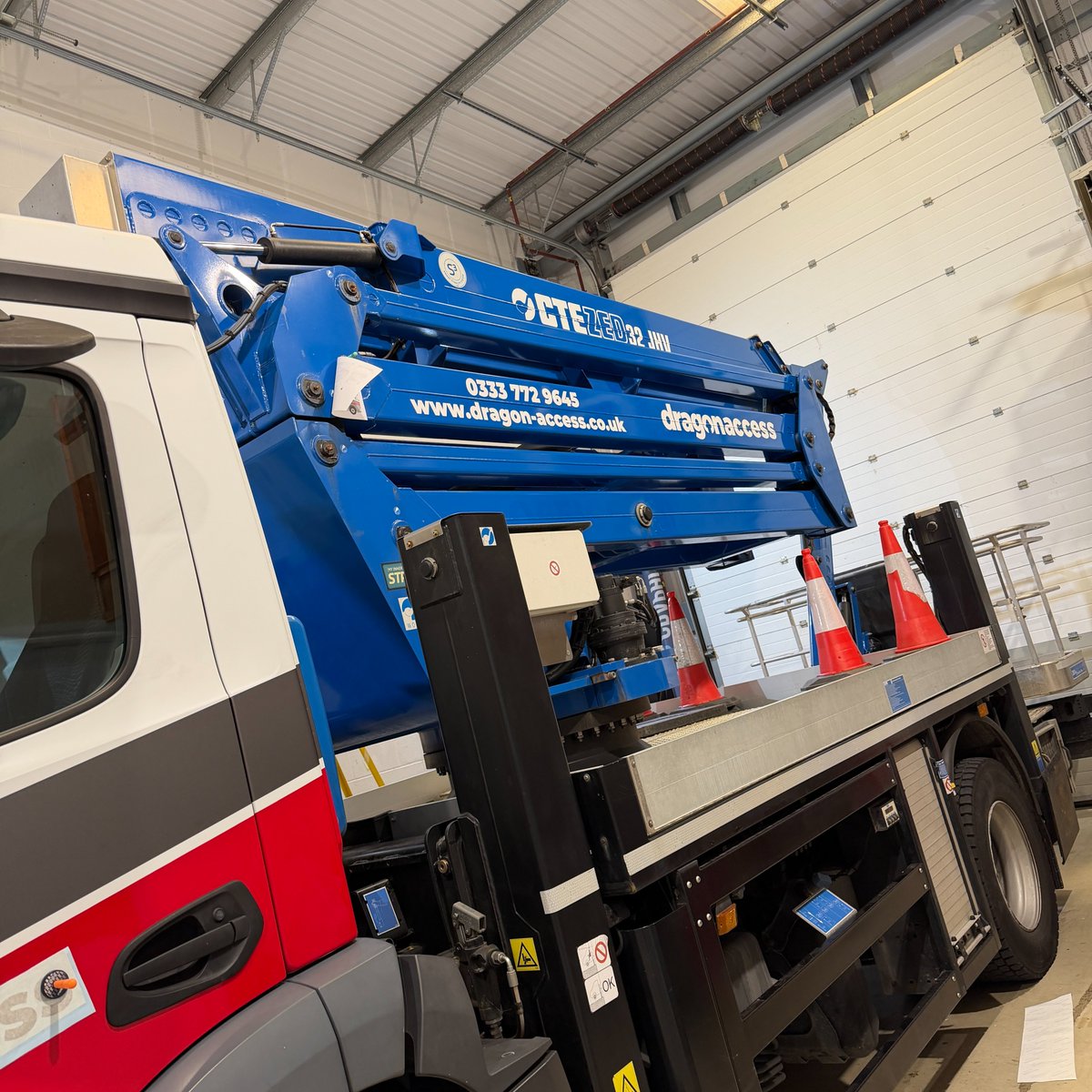 EliteSigns's tweet photo. Big vehicle. No problem. 👌 @DragonAccess' Actros branded inside our Bridgend vehicle bay. 20+ vehicles since 2013. #standoutwinbig https://t.co/JQwKAaQpE3