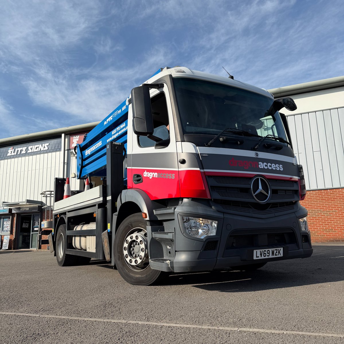 EliteSigns's tweet photo. Big vehicle. No problem. 👌 @DragonAccess' Actros branded inside our Bridgend vehicle bay. 20+ vehicles since 2013. #standoutwinbig https://t.co/JQwKAaQpE3