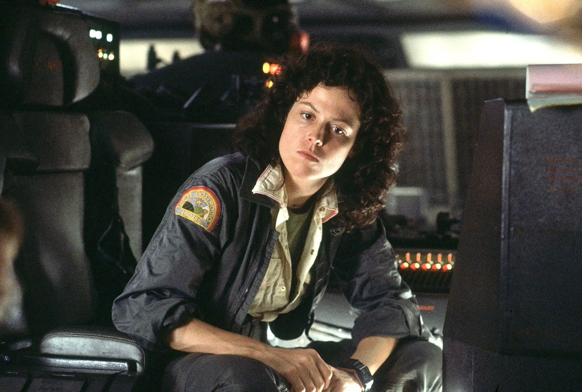 IMWDb_'s tweet photo. Ripley and Dallas wear two @CasioOfficial F-100s joined with orange plastic in Alien. The prop department built the wrist computer from contemporary digitals. Its fictional name, Samani E-125, came later with Alien: Isolation in 2014. https://t.co/kAZppzocKo