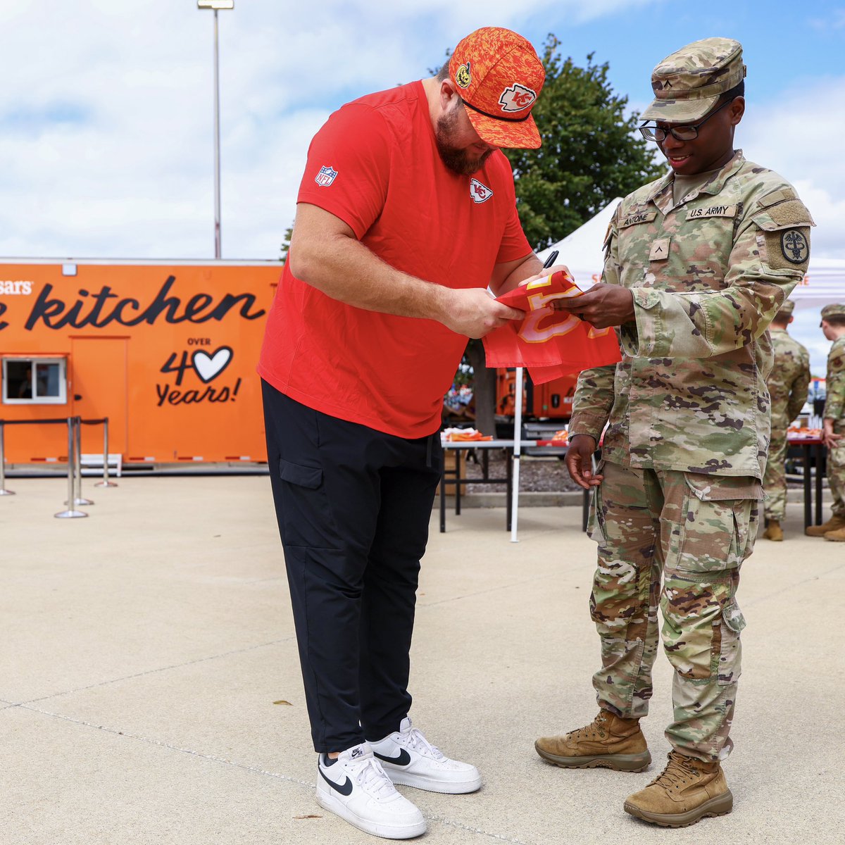 Chiefs's tweet photo. Serving up some love with @littlecaesars! We welcomed military families from Fort Leavenworth and Whiteman Air Force Base to Arrowhead for a special visit from the Love Kitchen Truck.

@creed_humphrey, Chiefs Cheer, and KC Wolf also joined in on the fun 🍕 https://t.co/t0ynPgTod4