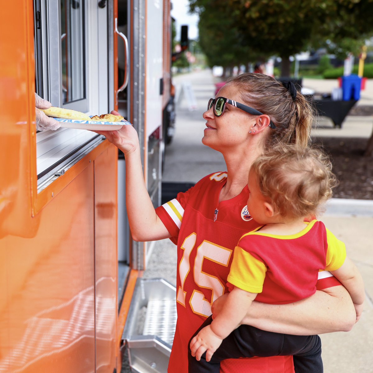 Chiefs's tweet photo. Serving up some love with @littlecaesars! We welcomed military families from Fort Leavenworth and Whiteman Air Force Base to Arrowhead for a special visit from the Love Kitchen Truck.

@creed_humphrey, Chiefs Cheer, and KC Wolf also joined in on the fun 🍕 https://t.co/t0ynPgTod4