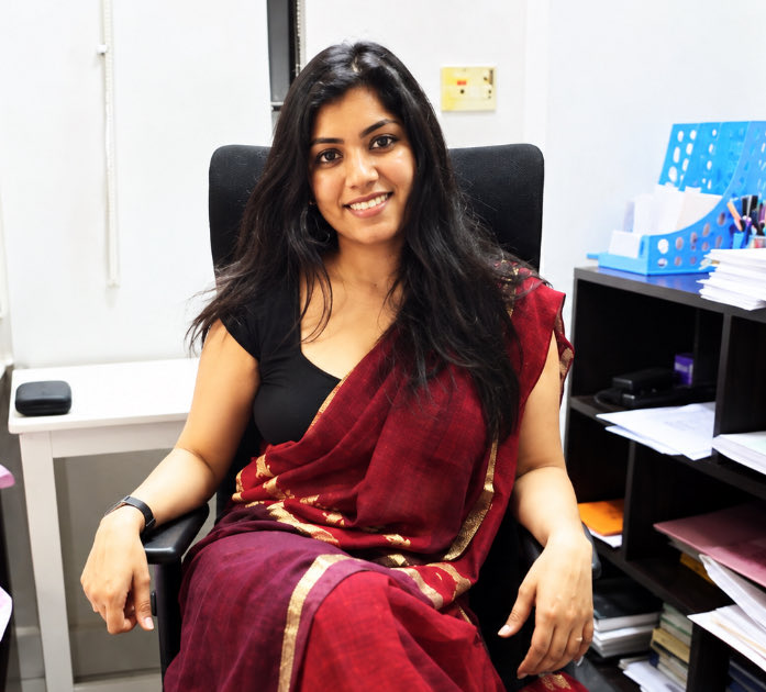 san_x_m's tweet photo. A High Court ordered a serving District Magistrate to pay a student 5 lakh rupees out of her own salary.

It said her conduct was worthy of derision, and that she was guilty of violating her oath of allegiance.

She took it to the Supreme Court and won a stay in 3 weeks.

Her name is Medha Roopam.

She is the District Magistrate of Gautam Buddh Nagar, the district that contains Noida. Her father is the Chief Election Commissioner of India.

In April 2026, tens of thousands of factory workers in Noida came onto the streets over their wages. The protest turned violent on 13th April.

A 25 year old Delhi University graduate named Akriti Chaudhary was detained under the National Security Act. Her family says she was picked up on the 11th, 2 days before the violence.

The NSA is not an ordinary arrest. It lets the state hold a person without charge and without trial, because of what they might do. There is no FIR to answer.

The District Magistrate signs that order.

Roopam signed it. Chaudhary spent more than 5 months in jail.

On 2nd September the Allahabad High Court quashed the detention. It found the order was devoid of material, passed without application of mind, and built on a story the state had concocted.

Then it turned to the officer who signed it.

It awarded 5 lakh rupees and ordered the money recovered from the salaries of the officials responsible, from the District Magistrate down to the Station House Officer.

Roopam did not accept it. She went to the Supreme Court, represented by the Solicitor General of India.

On 23rd September the court stayed the recovery, stayed the remarks about her, and stayed the release order too.

It also asked a fair question. An NSA file passes through several officers before it reaches a District Magistrate. Why should the money come from her alone.

Nothing is settled. The stay is interim.

But this is what it now turns on.

When a court finds a citizen was jailed for 5 months with no basis, who actually pays.

If it comes from the treasury, the taxpayer pays and nobody feels it.

The High Court tried to make the person who signed the order feel it.

The Supreme Court will decide whether that is allowed.