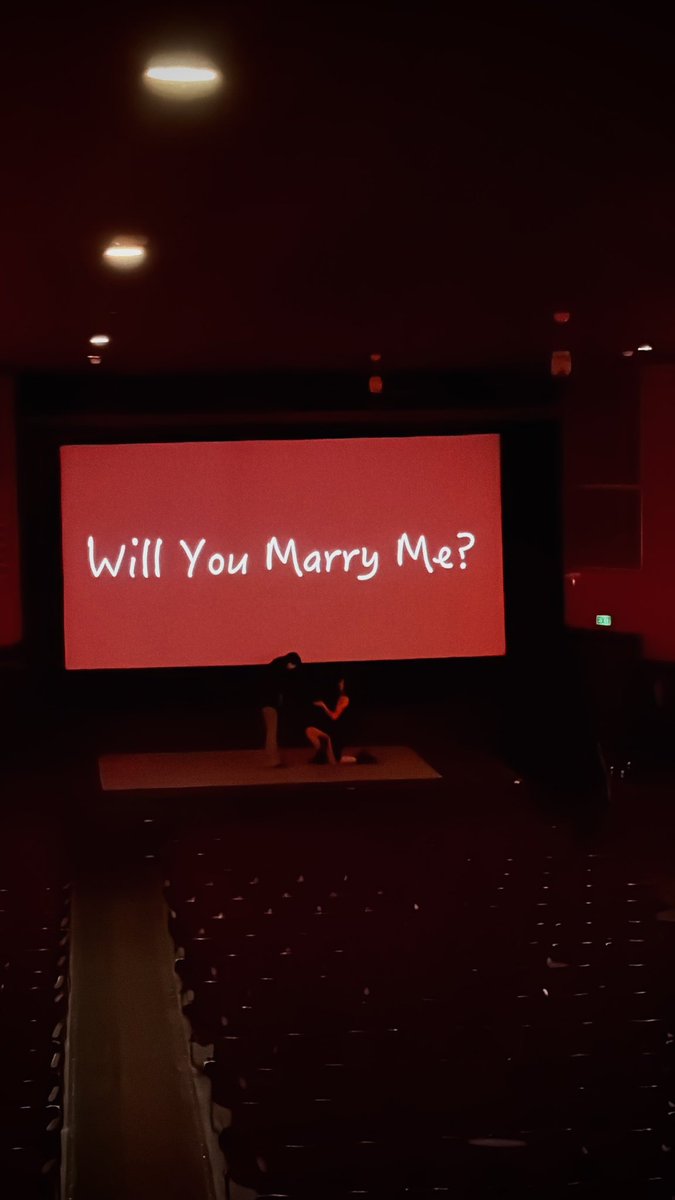 fangedfemme777's tweet photo. i proposed to my butch at an old local theater with a video compilation i made of us over the last five years and it was so perfect <3 https://t.co/7fVjHsKivC