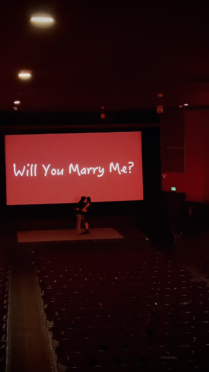 fangedfemme777's tweet photo. i proposed to my butch at an old local theater with a video compilation i made of us over the last five years and it was so perfect <3 https://t.co/7fVjHsKivC