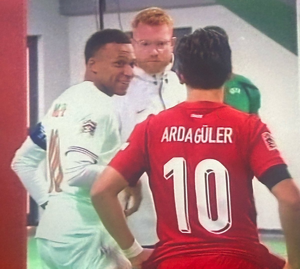 UTD_Seth001's tweet photo. 🚨 Arda Güler on his conversation with Kylian Mbappé at halftime during France’s 1-0 win over Türkiye:

🗣️ Arda Güler: “At halftime, Kylian came over to me and said, ‘You’re making our midfield uncomfortable. Every time you receive between the lines, we have to send someone toward you.’

“I told him, ‘That’s the idea.’

“He smiled and said, ‘I know. But you’re making us change things we didn’t want to change.’

“I asked him what he meant.

“He said, ‘Look at the space you’re finding. When you come inside, our midfield has to follow you, and that gives your full-back more room. When we don’t follow you, you turn and attack us.’

“That was interesting because that’s exactly what we were trying to do.

“I told him, ‘And when you move inside, we have the same problem.’

“He laughed and said, ‘That’s why football is difficult.’

“Then he told me something I remembered for the rest of the game.

“‘Don’t chase the game. Make the game chase you.’

“I understood what he meant.

“He was telling me that when you have the ball, you don’t always need to force the final pass. Sometimes you move the opponent first, wait for the space to appear and then attack it.

“That is something I learned from playing against him.

“People see Mbappé and think only about his speed.

“But his movement without the ball is what makes him so difficult.

“He can start wide, come inside, drag a defender with him and suddenly there is space somewhere else.

“That conversation lasted maybe two minutes.

“But I walked back onto the pitch thinking about it.

“And when you can learn something from the player standing on the other side of the pitch, you take it.

“Because that’s football.

Sometimes your biggest lesson comes from the opponent who is trying hardest to stop you.”
