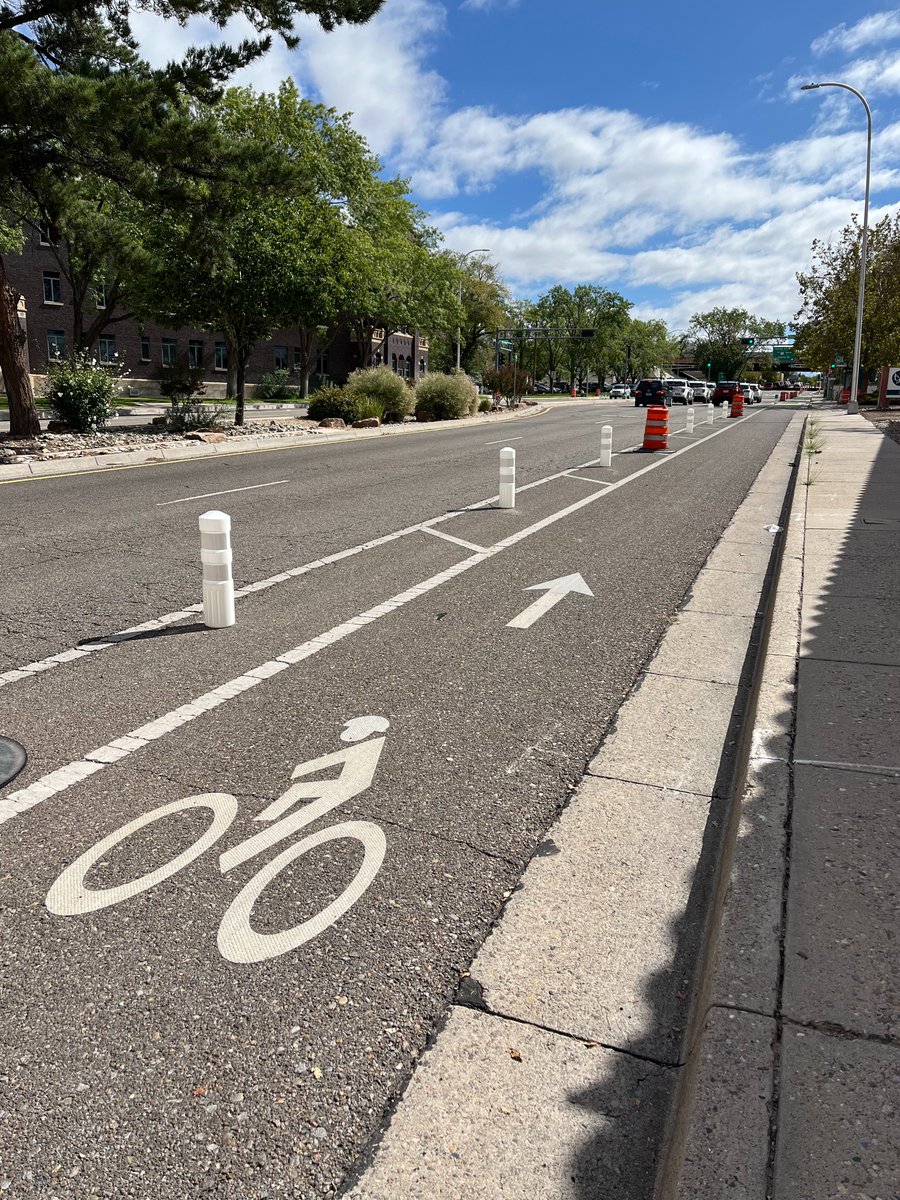 BikeABQ's tweet photo. The City's bike lane protection pilot project along MLK is taking shape. Check it out, and if you like what you see, contact your City Councilor and let them know.

More info: https://t.co/lG19eyJ8Hb https://t.co/8ZgIANW6Xy