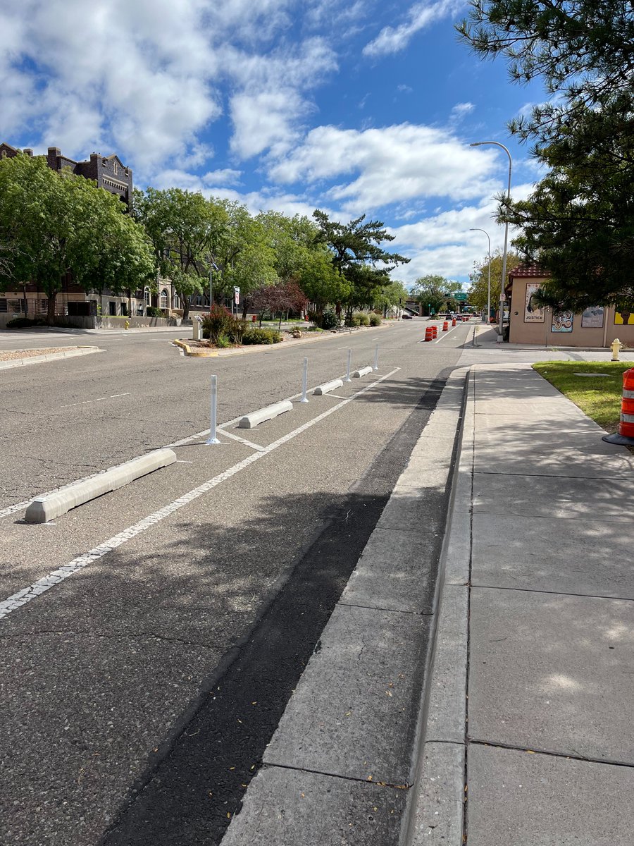 BikeABQ's tweet photo. The City's bike lane protection pilot project along MLK is taking shape. Check it out, and if you like what you see, contact your City Councilor and let them know.

More info: https://t.co/lG19eyJ8Hb https://t.co/8ZgIANW6Xy