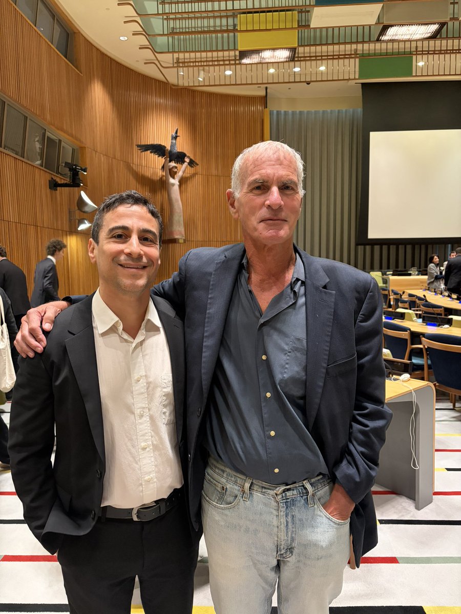 aaronjmate's tweet photo. At the UN for The Hague Group meeting with the man who exposed Gaza’s Gravediggers. @normfinkelstein @orbooks https://t.co/teHU6GHHLj