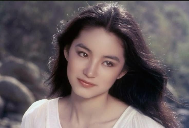 hitnnie's tweet photo. i've always thought of her that way! her beauty is so unique and striking just like those 90s hong kong actresses. she has such a distinct vibe https://t.co/J6EWZQaf3e