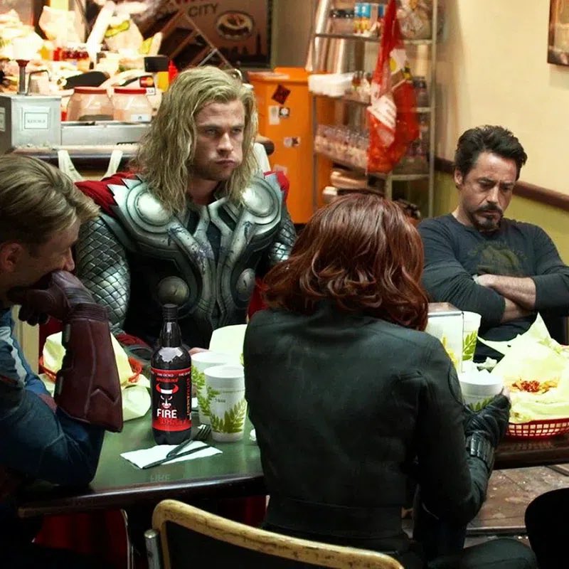 astralpoli's tweet photo. What did Chris Evans hide at hand in the Avengers finale?

The famous post-credits scene, where tired superheroes silently eat shawarma in a New York snack bar, was filmed at the very last moment. The director spontaneously decided to add this comedy episode, urgently gathering the actors together.

By that time, Chris Evans was already preparing for filming in the movie "Thre Through the Snow" and managed to grow a decent beard. It was impossible to shave it for the sake of a minute scene under a contract with another project, and Captain America had to remain clean-shaven according to the plot.

A massive rubber jaw prosthesis was put on Evans' chin to hide the vegetation, but the artificial pad looked quite unnatural on the face and constrained facial expressions. Therefore, we decided to go for an extremely simple and banal way - to cover the chin with your hand, which turned out to be in the topic.

In my opinion, one of the best and soulful scenes after the credits throughout the Marvel cinematic universe, what do you think?