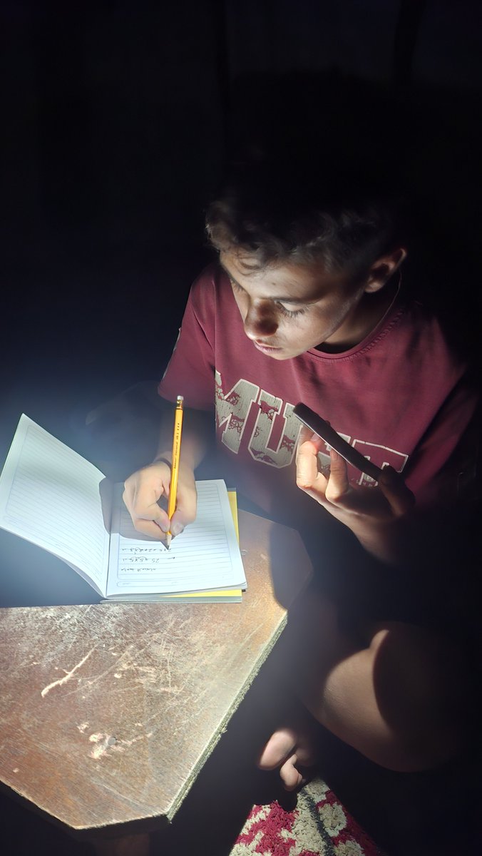 AdnanfromGaza's tweet photo. TOMORROW I HAVE A MATH EXAM… BUT HOW CAN I STUDY WITHOUT ELECTRICITY? 💔

I’m trying to study in the dark using my phone as a light, while my dream of learning and succeeding continues. Even studying has become a struggle in Gaza. 🥀📚

We need $250 to buy a rechargeable light so I can study properly without these obstacles. Any help, no matter how small, means so much to me. ❤️‍🩹