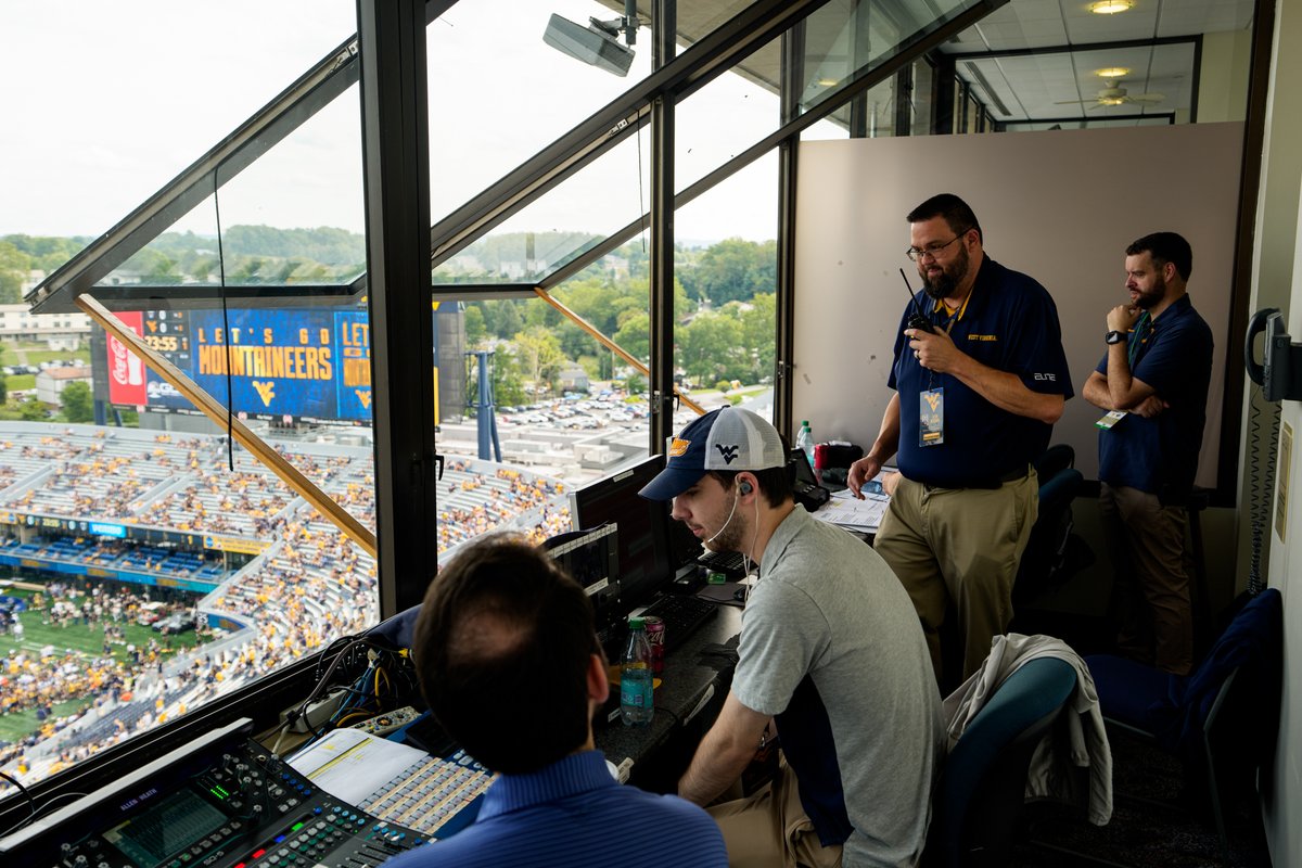 WestVirginiaU's tweet photo. What does it take to fire up 60,000+ Mountaineers on game day? 🏈

From music to graphics, nothing is random. For 16 years, West Virginia native Sean Merinar has been curating your game day experience. 💛💙🎤

Take a look behind the scenes:
https://t.co/Tv9TKsJoA6 https://t.co/6j12l6QYT6