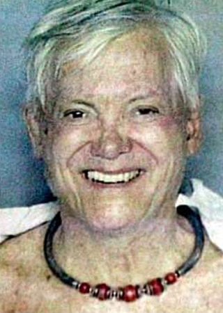 25YearsAgoLive's tweet photo. Gloria/Gregory Hemingway, daughter/son of author Ernest Hemingway, is arrested in Miami after walking down the street completely naked except for a pair of a high heel shoes. 

When police tried to detain him/her, he/she screamed and kicked officers. 

Upon arrest, Hemingway gave her/his name as “Greg Hemingway,” but then asked to be called either “Gloria” or “Gregory” upon arrival at booking and said that he/she was both a man and a woman. 

Police asked if Gloria/Gregory is transgender and he/she answered in the negative.
