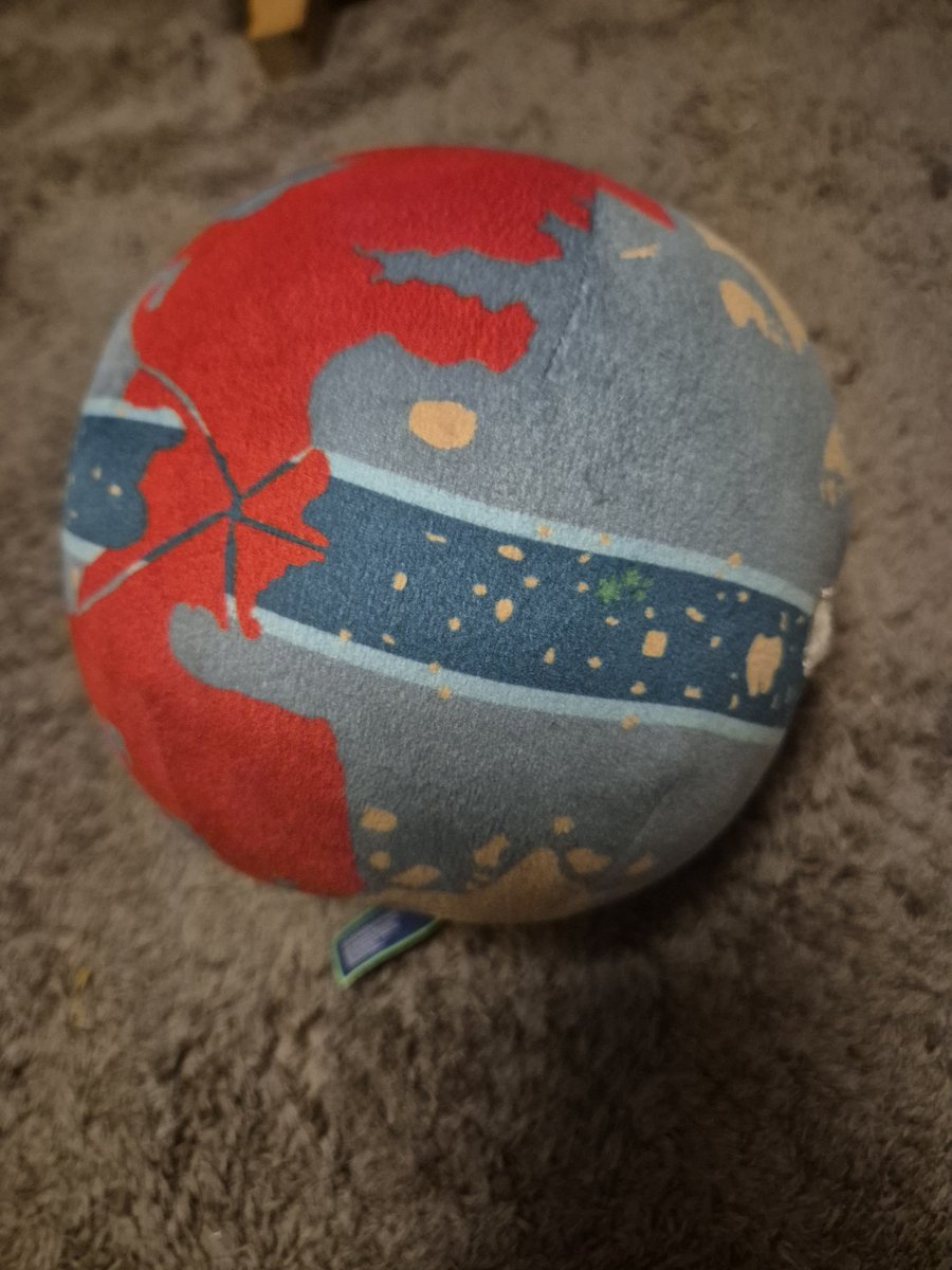 IntroArcade's tweet photo. Had this original blue @newworldartur globe plush casually sitting on my side table for years without realizing the absolute history behind it! Pristine, unfaded, and easily my favorite piece of One Piece merch. 🗺️🏴‍☠️ #ONEPIECE〜 https://t.co/7RbJ7U2mBO
