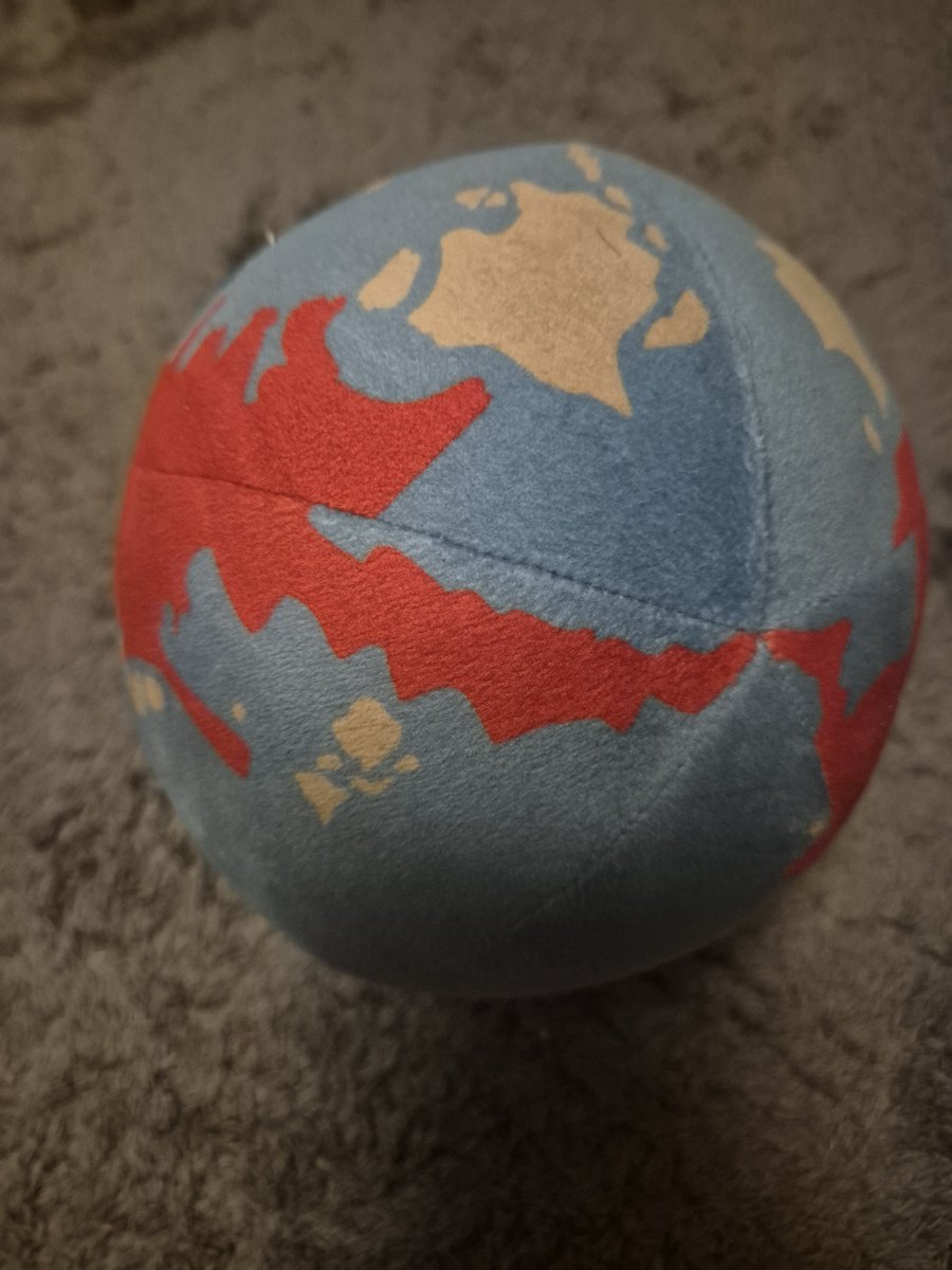 IntroArcade's tweet photo. Had this original blue @newworldartur globe plush casually sitting on my side table for years without realizing the absolute history behind it! Pristine, unfaded, and easily my favorite piece of One Piece merch. 🗺️🏴‍☠️ #ONEPIECE〜 https://t.co/7RbJ7U2mBO