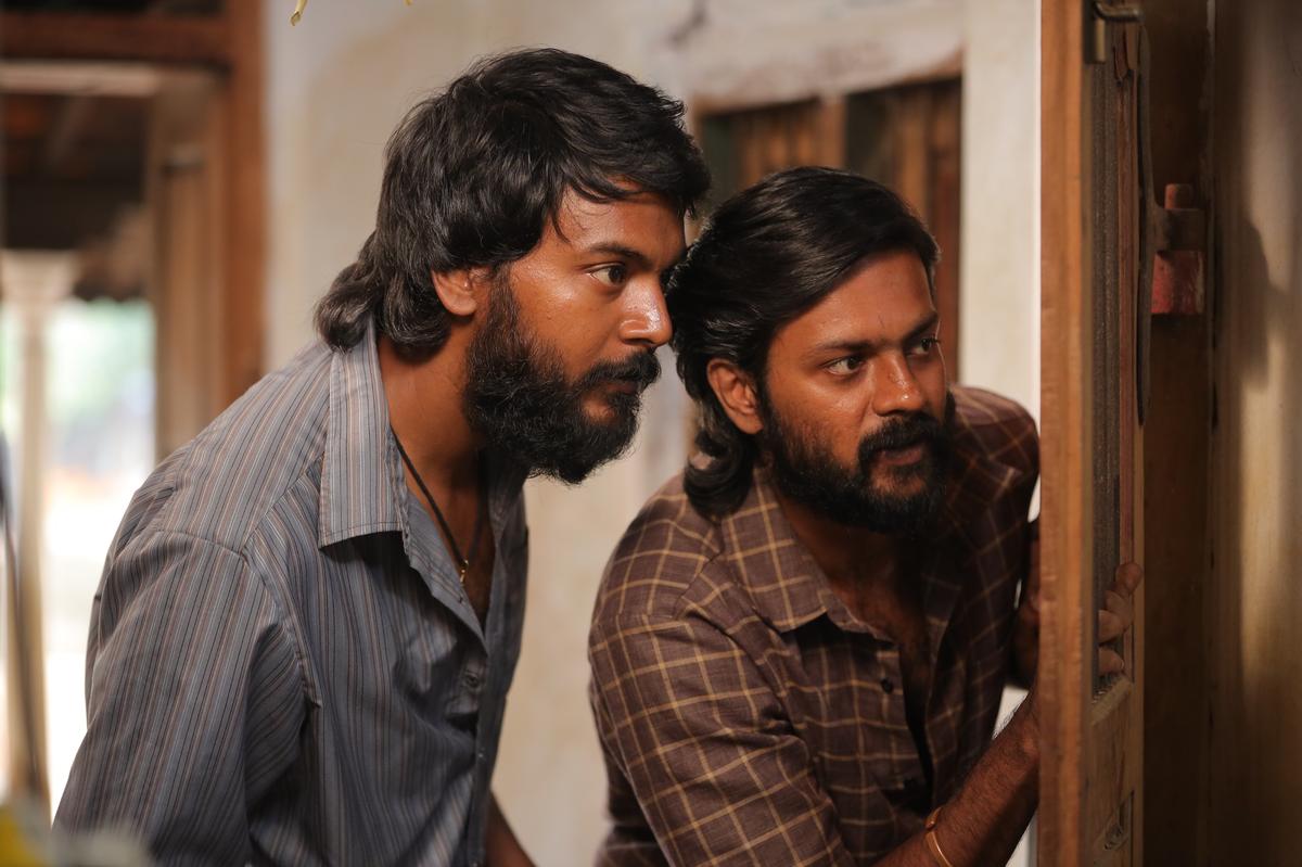 sudhirsrinivasn's tweet photo. Mannnnyyyy, mannnyyyyyyy thoughts on #Dorothy 

(possible spoilers, so stay away if you want to know nothing about the film):
_____

Dorothy is almost a horror film, isn’t it? The setting of period Madurai feels like a ghost town, where anecdotes of murders and suicides are casually shared. “This is where my mother and sister’s bodies were found!” says young Subbu. Something about this young boy being so nonchalant about it broke me, just as it does his friend, Karthi. But then, he gets told: “Boys don’t cry.” Because? Women do, and in this neighbourhood, the women who survive are those who become agents of the system themselves: like Dhanam’s mother, who joins her husband in beating up their daughter.

Innocence dies quickly here too, like the skinned rabbits that hang about in Subbu’s home. Love dies even faster, as Karthi (Rishikanth) discovers to his dismay. And it’s all so casually, quickly done, isn't it? A theatre owner promises to get Karthi married to his girlfriend, and in the very next shot, she’s standing as a bride. Only, she’s marrying someone else, and the theatre owner is right there, telling Karthi not to waste tears over a pottachi. The transition is almost funny. Even the editing seems to have learned the cruelty of this place. There’s no time to mourn. You move on.

You are told to toughen up, or at least, perform. And so, boys learn to perform, so they can feel like men. And like with performances, you learn the lines ("pottachi madhiri azhugaadha!"), the insults ("ajakku!"), and you win the respect of your peer group. And eventually, with time, the performers become trainers themselves, and the cycle continues on and on, with any anomalies quickly turned into casualties, while the whole system works to clean up the mess and pretend nothing strange happened.

If someone suggested the premise of a film in which there are no women, well, that sounds dystopian, frightening, no? And yet, is the world of Dorothy too different? Any woman who aims to preserve her identity in this violent world seems destined for violence. And that first big death in Dorothy is a total shock, both to us and Subbu (Sananth). I loved performances across the board (Rishikanth, Sananth, Muthukumar…), but in this scene especially, it’s gut-wrenching to see innocent Subbu walk to the husband first, and later, to his own father, examining their bodies for signs of injuries, trying to confirm to himself what he already fears and knows. There’s simply no place for ‘softness’ here, even if the commercial outlets in this ghost-town are named after women, like Angel Textiles.

It’s a film that portrays how crying has been vilified in such a society, especially when it pertains to men. There’s a curious connection to Karthik’s last film, Retro, too: there, the hero couldn’t laugh; here, he isn’t supposed to cry. Crying here means softness. Softness means femininity. Femininity means weakness. And weakness, in this world, gets humiliated. That’s why, in the aftermath of this big death, Karthi, trying to be supportive, tries to train Subbu into channelling his sadness through violence and rage.

For a brief minute, we see Subbu beating up a transwoman, and we think, maybe, he’s become one of these men. But I enjoyed how Karthik’s film leaves you with such ideas only to make you form new conclusions as it goes along: like when Karthi casually drops the ‘ajakku’ word earlier in the film and you learn its weight later. Like when Subbu fails to sustain his inner rage, unlike Karthi, and we later understand why. Subbu, you see, cries openly, constantly, and it’s a real problem for all the men around him. That’s why they’d rather have him die than become who he eventually becomes.

Those shots of the family’s outrage as they peer at him through a window… That's almost another horror-film image. They look at Subbu as though they’re staring at something monstrous, after we’ve spent all this time seeing what evil actually looks like. And when Subbu comes out, that feels straight out of a supernatural film too, almost like the spirits of many dead women are passing through him in that moment. It’s touching that Subbu is allowed to express himself only with two characters, and how both of them turn out to be women. The consequence of this softness is violence, of course. Not the kind you can tolerate for a day or two and move on from. It’s the kind of violence that wants to end you, as nature remains a detached observer.

That long fight between three men just before interval is disturbing for precisely this reason, because it captures how quickly a genuine apology can turn into a fight for survival. One man is driven by his need to protect honour; one is driven by his desire to protect a woman; and the third is driven by his desperation to save a friend. Karthik Subbaraj really takes his time with this fight, capturing its ridiculousness with wide shots that place these three men in an empty, red land. They’re fighting for their lives, and the earth seems entirely uninterested, almost seeing it for the cruel joke it is.

Like Karthi and Subbu, this film keeps finding new ways to stay alive, with the very literary device of a potential assassination looming over the entire second half. Strangely, I didn’t see these stretches as selling suspense or thrills. Instead, in this frightening film, Karthi’s struggle to deal with Subbu seemed to speak of hope to me: the hope that some inner, innate goodness might somehow prevail even when every survivalistic instinct dictates otherwise. As the film itself says at the end, “Manasu kadavul, budhdhi saathaan.”

There are so many memorable moments I’m thinking about when I consider this film. The idea of a soft man puking at violence. The visual of this man surrendering to a strange woman in tears. That gorgeous mirror shot at the end. A transwoman who’s kicked out of a hotel, being thought worthy of blessing a child just a moment later. Karthi, on the verge of unlearning his prejudices, being asked at a hospital: “Vesham erangirucha?”

Above all, there’s that gorgeous reunion when Karthi sees Subbu after a long time, as Ilaiyaraaja’s repurposed Veedu score kicks in. Good luck not sobbing your heart out. Or how about when Ilaiyaraaja’s violins take over, as Karthi’s mother offers Subbu way more kindness than Karthi ever did, perhaps because she gets him in a way that Karthi never could due to his conditioning? In a film in which people keep teaching each other how to harden, these little embraces, these little acts of kindness feel rebellious, spectacular.

Sure, perhaps there are dialogues I’d rather have let the story tell me. Like the paaliyal-paagubaadu line that gets said twice. Or a small, lecture-like speech Subbu delivers towards the end, which felt less like dialogue and more like the film making its point through him. It’s especially noticeable because Dorothy has already shown us these ideas so powerfully that it doesn’t always need to articulate them. And sure, perhaps Karthi’s final emotional transformation needed more work too, that gorgeous mirror shot notwithstanding, the awesomeness of Ilaiyaraaja's Muthumani notwithstanding. He had already processed so much by then that I wasn't sure if he would be ready for this revolutionary leap the film wanted him to take so soon.

Just before all of that though, there’s another favourite moment of mine, one that speaks to the difficulty of Subbu’s transition not just for Subbu, but for Karthi. For a moment, you sense Karthi registering the loss of his friend as he knew him. In this film of many deaths, here is a death that doesn't leave a body behind. Karthi may or may not be relieved that Subbu is alive, but somewhere inside, he's already mourning the loss of his friend. And Rishikanth beautifully sells this loss. The film allows us to recognise this grief even while questioning the prejudice that causes it.

There’s a moment when you wonder how Karthi’s conflict is going to get resolved, how his scheming and deception are going to be purged from him. What conversation would make him confess? What event would make him buckle? What twist would make him reveal his motive? But those are ideas you’d see from a lesser filmmaker. What Dorothy does is simply let this man stand there on a hill, in isolation, far away from the caustic society that shaped him, in the presence of sunlight and wind. And… this seems enough.

Away from the voices that taught him what a man must say and how he must act, perhaps Karthi could finally hear himself. Away from the trappings of stardom, from the pressures of having to create actor-focussed entertainment, with Dorothy, it feels like perhaps Karthik could finally hear himself too.