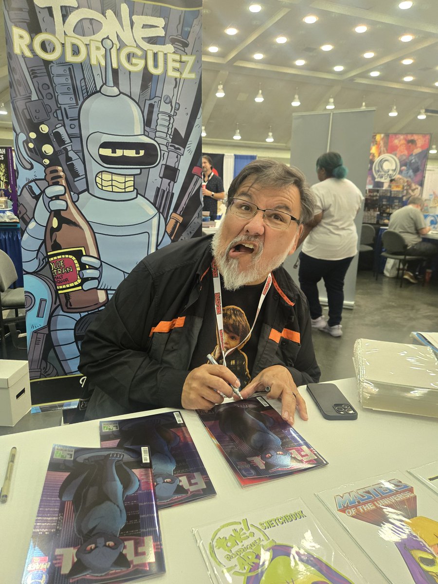 heroinitiative's tweet photo. Cats, chaos, and comics: Tone Rodriguez (Feral, Stray Dogs, The Simpsons Comics) is at our booth this weekend. Find him at 1701 during @baltimorecomics! 

#BeTheHero #BCC2026 https://t.co/ithGVbjDXr