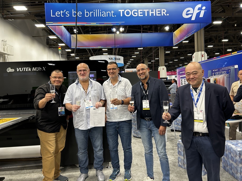 EFIPrint's tweet photo. Congratulations to Litográfica e Imprenta Hermanos Salas on their investment in the #EFIPro 16h+ printer, with our valued partner Grupo SG! It was a pleasure to welcome owners Ulises Salas &amp; Alex Salas to the EFI booth at #PRINTINGUnitedExpo to celebrate this exciting milestone. https://t.co/0GmTEH5lAe