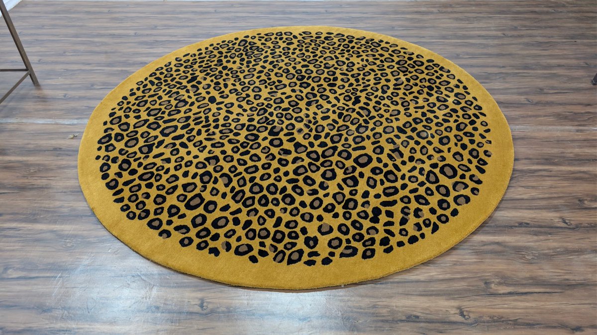 CMRugsStudio's tweet photo. A round rug with a wild side. Hand-tufted in fine New Zealand wool, our cheetah-inspired design is made to order in round sizes, with custom diameters available. Actual rug photo. Explore sizes: https://t.co/3qiKpWZbLE https://t.co/JTzszTJ7gO