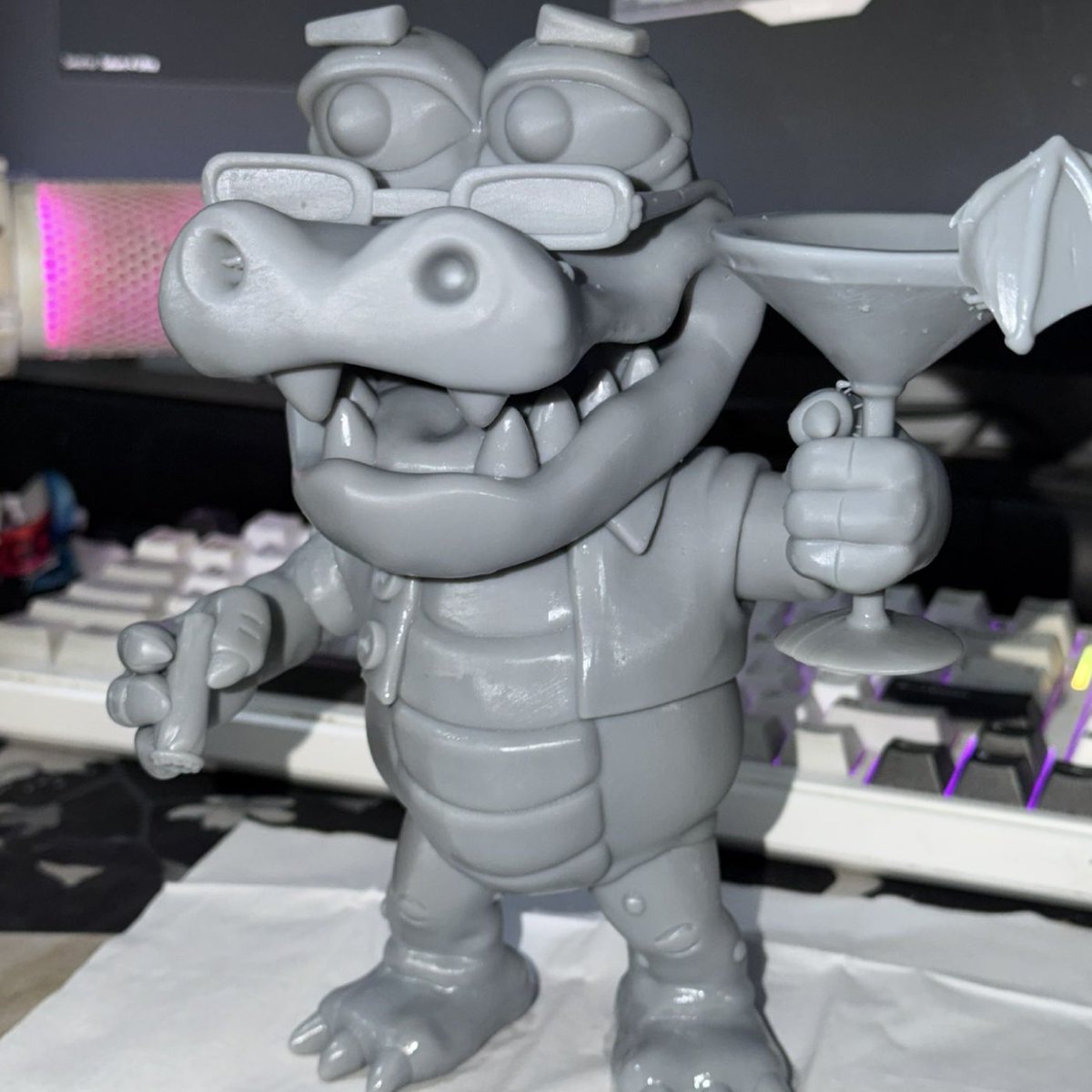 Dexerto's tweet photo. GTA 6 fans are already 3D-printing their own Macca the Gator figures instead of buying the $400 Collector’s Box

A fan-made 3D model has been shared online so anyone with a printer can make their own https://t.co/2AwCXuTilA