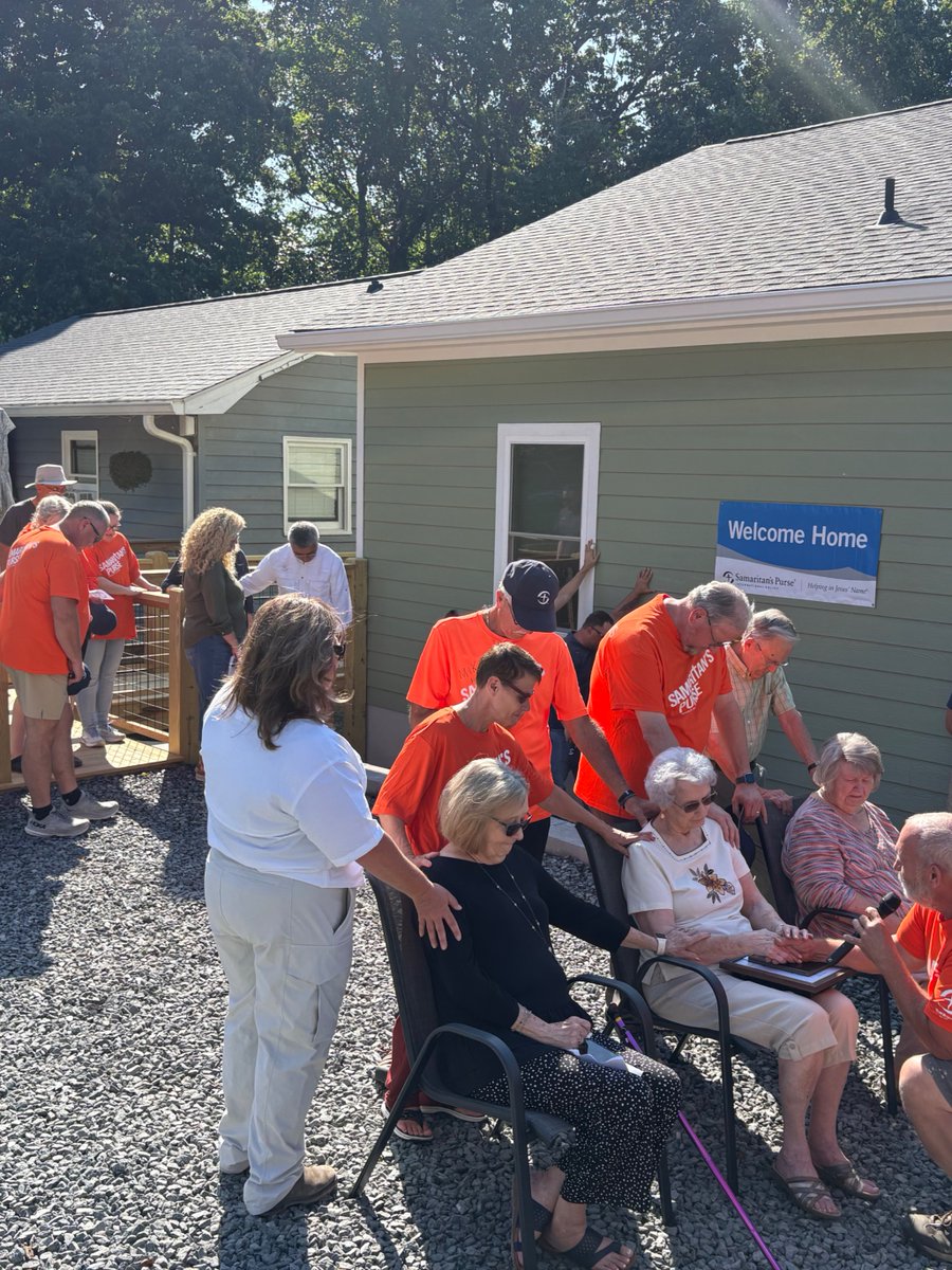 SamaritansPurse's tweet photo. Mary had lived in her home for 58 years when a landslide caused by Hurricane Helene destroyed everything she had ever known. By all accounts, she should not have made it out alive. The only part of her home left standing was the corner she was in. God’s hand of protection was on her. 

When she got the call from Samaritan’s Purse saying she would be the recipient of a new home, she couldn’t imagine why anyone would help her. 

She never expected to have another home to call her own, let alone a brand new one. 

Her spunk and smile brought laughter to all the volunteers on hand to welcome her home, as she walked around opening cabinets, peeking in doors, and admiring the furniture. 

She sat side by side with her lifelong best friend in an overstuffed chair in her new living room - in disbelief of all that God has done. She’s now in a home that will keep her secure for all the years to come and surrounded by generations of family who live on the same piece of land just feet from her front door. 

We praise God for allowing us to serve as the hands and feet of Christ in giving Mary a new home so that she can be settled and safe! 

We are still accepting applications for assistance from anyone whose homes were impacted by Helene. Visit https://t.co/yxc47G9i3k to learn more.