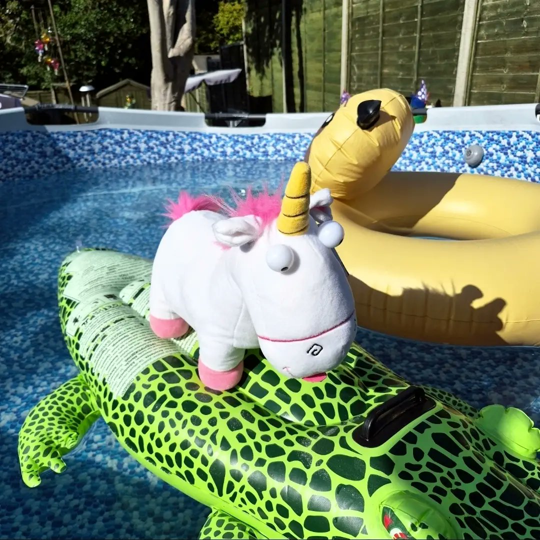 ALovrec's tweet photo. Just a girl and her unicorn. I never thought I’d find the Despicable Me unicorn plush, but a toy sale brought us together. We’ve been inseparable ever since. Here she is enjoying this glorious weather. https://t.co/EXUrlhxkRq