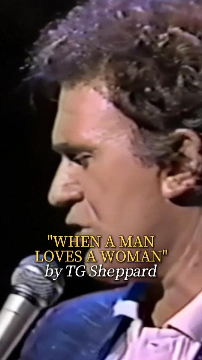 A vintage video still shows country singer T.G. Sheppard performing his song 'When a Man Loves a Woman,' with the song title and artist name displayed in yellow text.