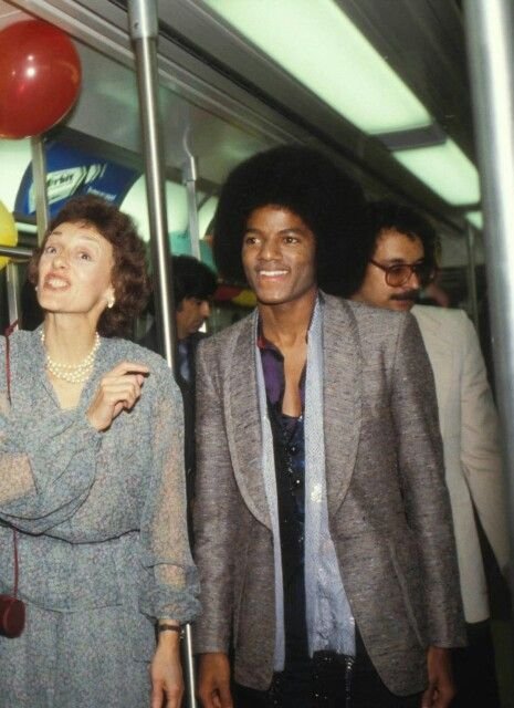 DullahTheking2's tweet photo. Michael Jackson riding a special subway train with Second Lady Joan Mondale and New York City Mayor Ed Koch in October 1978.....A rare glimpse of Michael during his early rise to fame.

📷 1978. https://t.co/6lfzXMzqqs