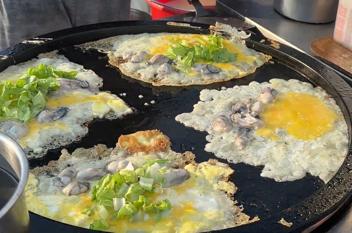 MaxineStulmq70's tweet photo. Craving a crispy Taiwanese oyster omelet from the street stall Golden, savory, and full of fresh flavor—best late-night snack ever!， https://t.co/DjB6Jf9nNy
